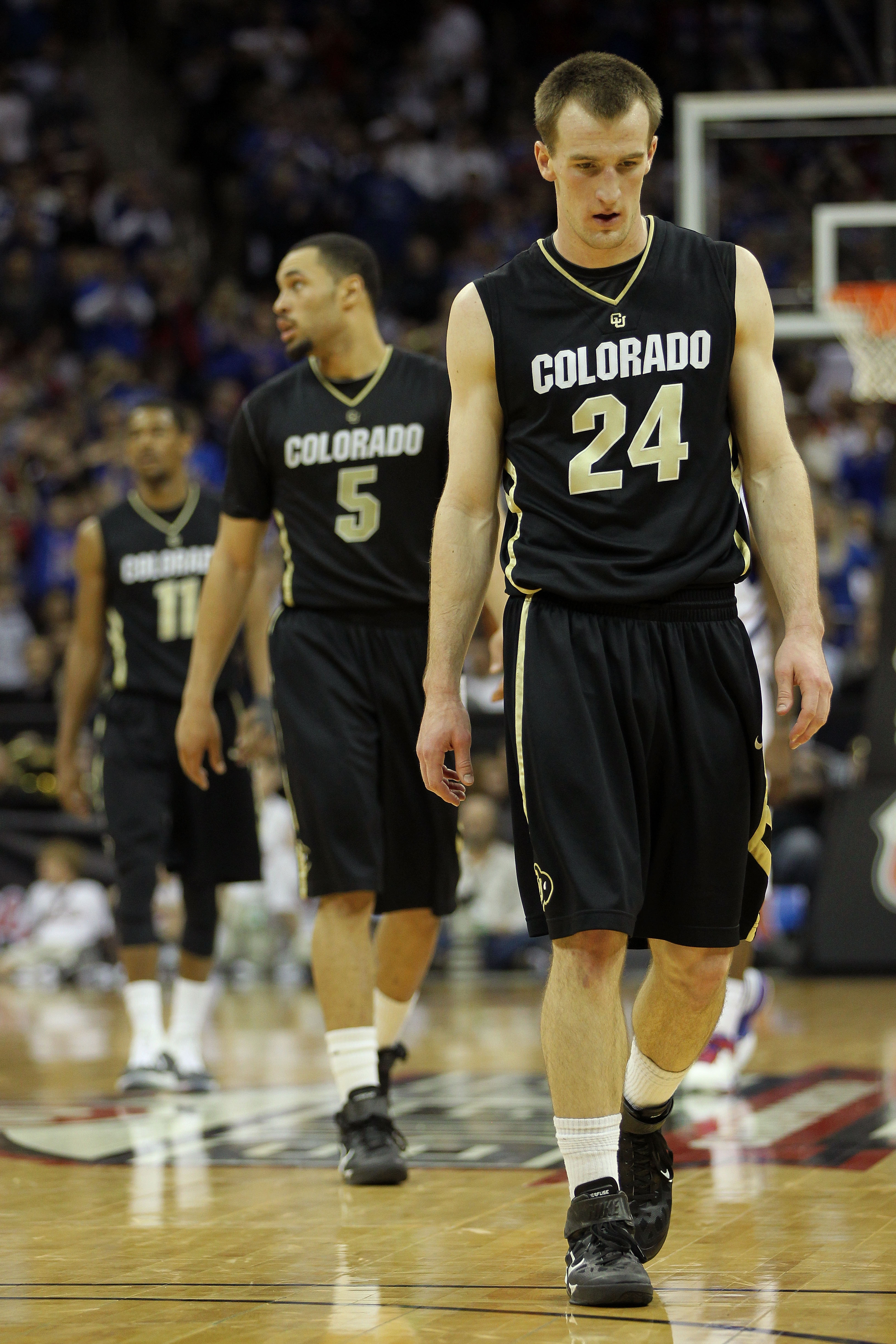 KANSAS CITY, MO - MARCH 11: Levi Knutson #24, Marcus Relphorde #5 and Cory Higgins #11 of the Colorado Buffaloes walk on the court during their semifinal game against the Kansas Jayhawks in the 2011 Phillips 66 Big 12 Men's Basketball Tournament at Sprin KANSAS CITY, MO - MARCH 11: Levi Knutson #24, Marcus Relphorde #5 and Cory Higgins #11 of the Colorado Buffaloes walk on the court during their semifinal game against the Kansas Jayhawks in the 2011 Phillips 66 Big 12 Men's Basketball Tournament at Sprin