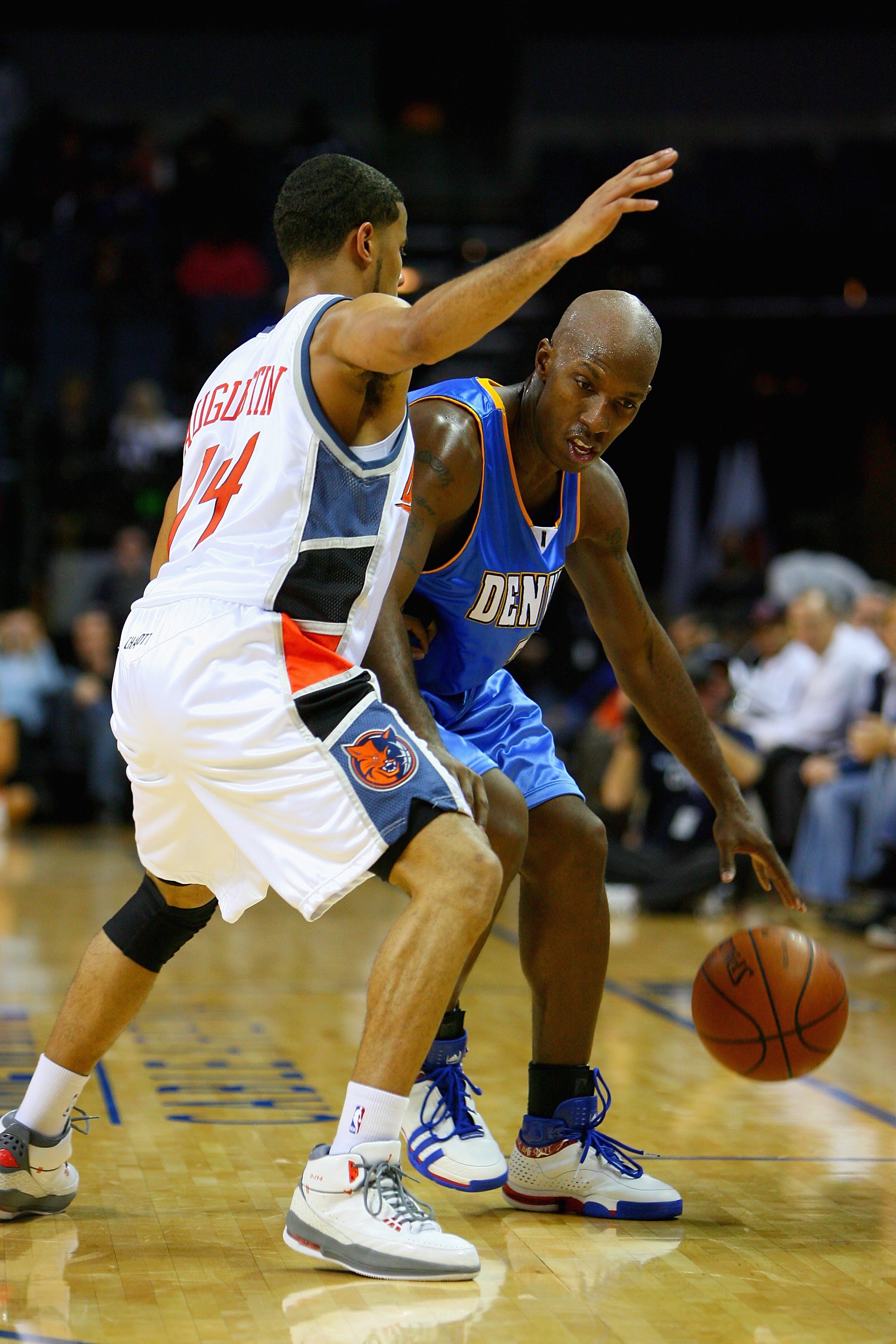 CHARLOTTE, NC - NOVEMBER 11:  Chauncey Billups #7 of the Denver Nuggets goes up against D.J. Augustin #14 of the Charlotte Bobcats during the game on November 11, 2008 at Time Warner Cable Arena in Charlotte, North Carolina.  The Nuggets won 88-80.  NOTE