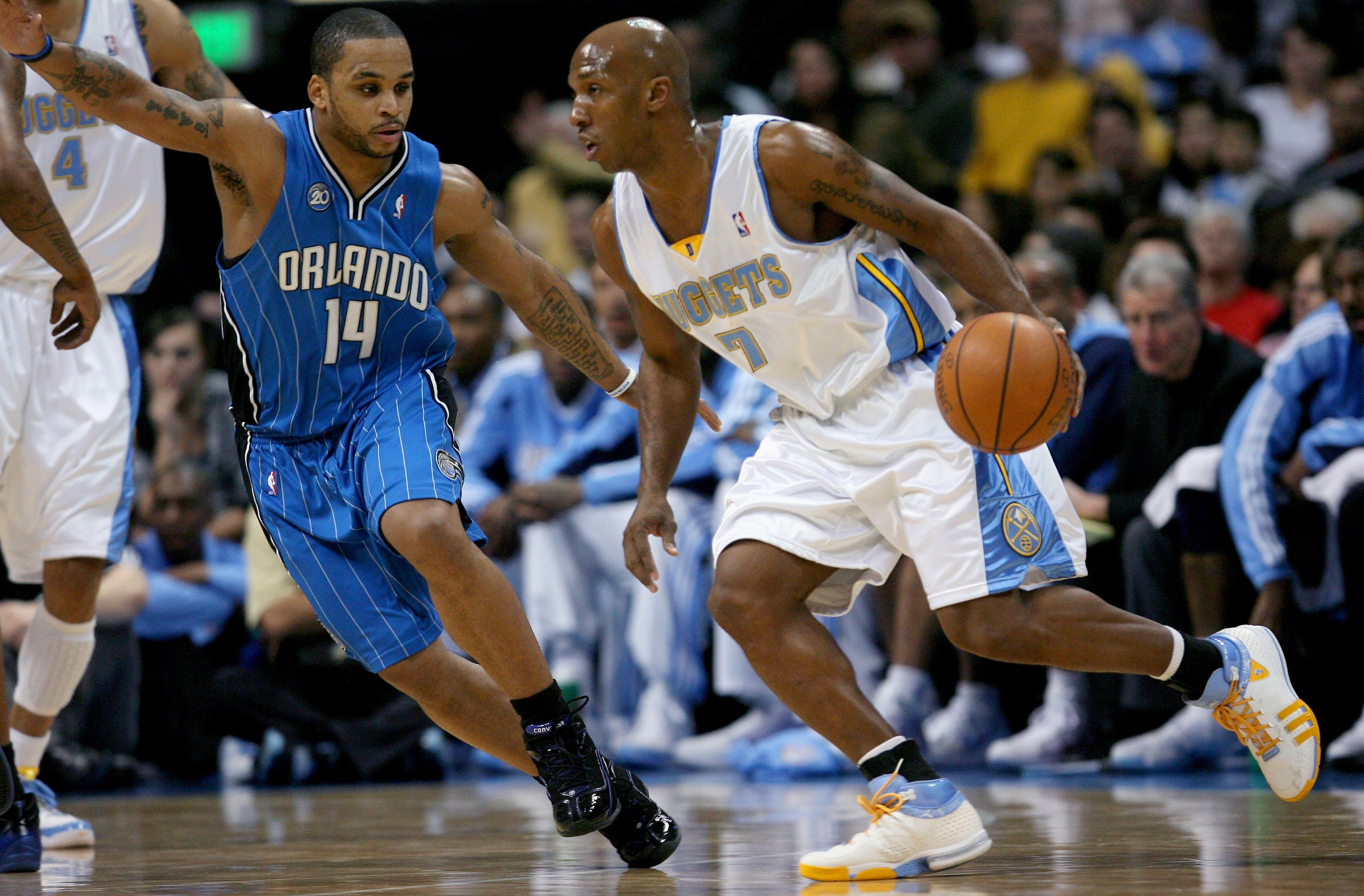 DENVER - JANUARY 17: Chauncey Billups #7 of the Denver Nuggets drives against Jameer Nelson #14 of the Orlando Magic during NBA action at the Pepsi Center on January 17, 2009 in Denver, Colorado. NOTE TO USER: User expressly acknowledges and agrees that, DENVER - JANUARY 17: Chauncey Billups #7 of the Denver Nuggets drives against Jameer Nelson #14 of the Orlando Magic during NBA action at the Pepsi Center on January 17, 2009 in Denver, Colorado. NOTE TO USER: User expressly acknowledges and agrees that,