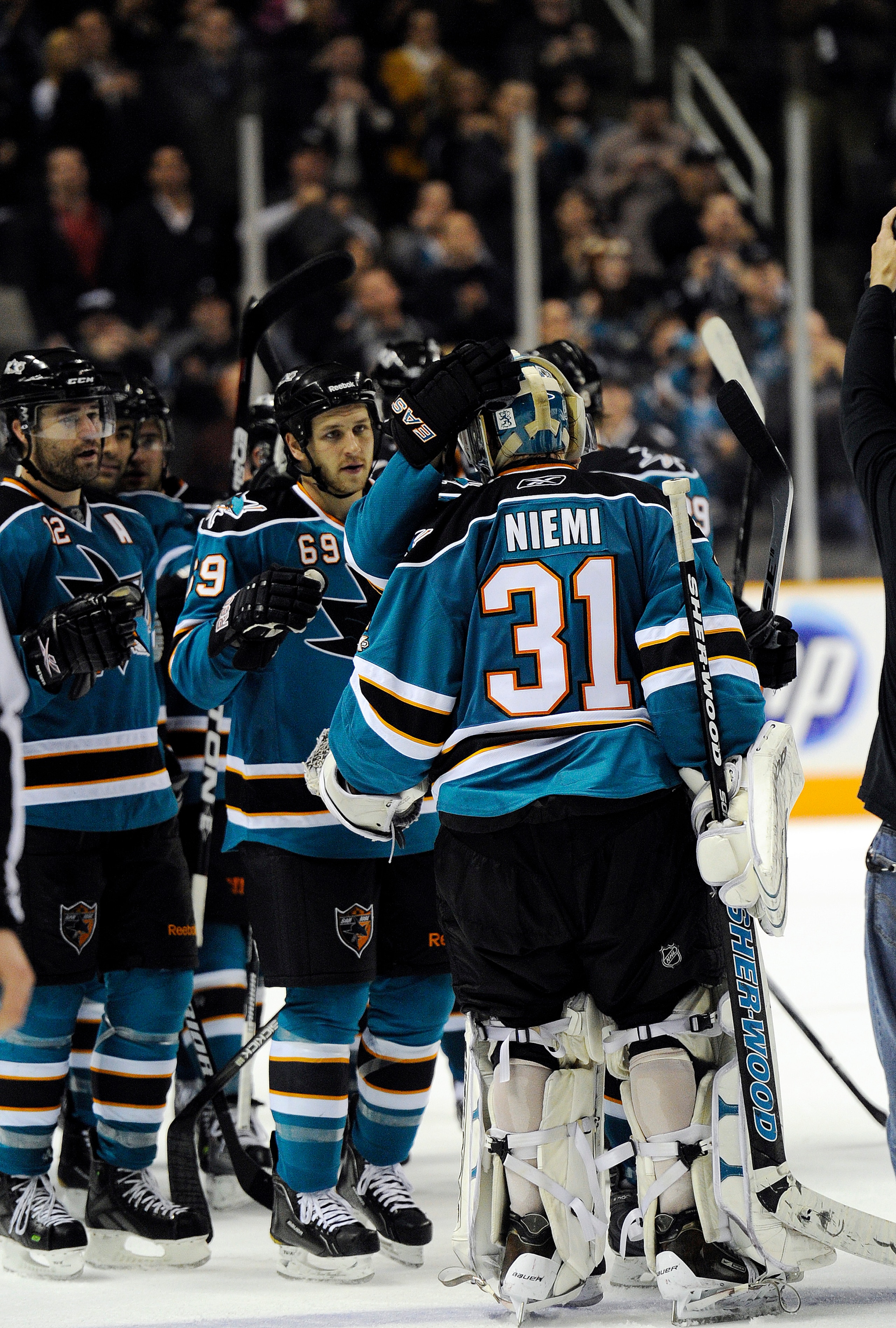 SAN JOSE, CA - MARCH 8: Goalie Antti Niemi #31 of the San Jose Sharks one of the star of the game is greated by teammates after the Sharks beat the Nashville Predators 3-2 in overtime of an NHL hockey game at the HP Pavilion on March 8, 2011 in San Jose,