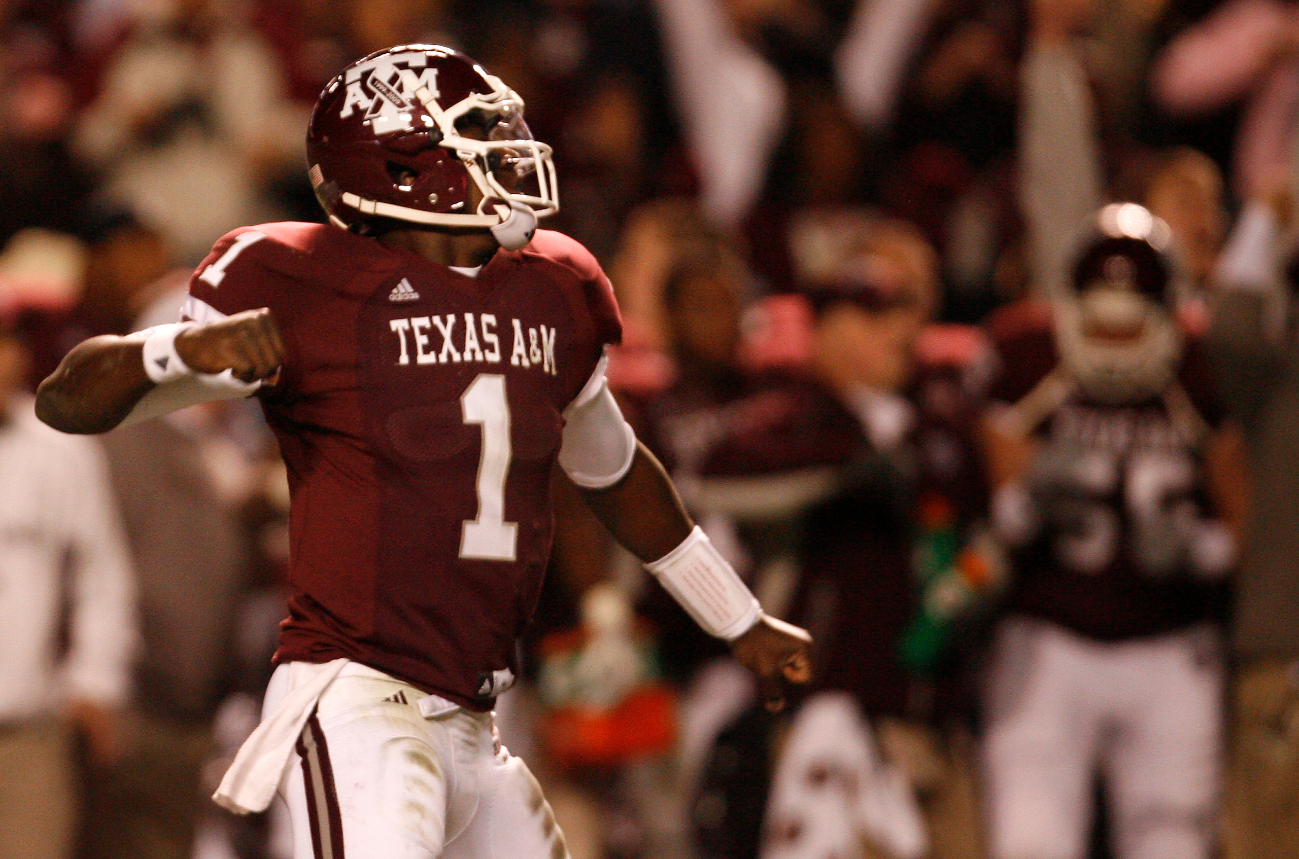 COLLEGE STATION, TX - NOVEMBER 26: Quarterback Jerrod Johnson #1 of the Texas A&M Aggies celebrates after throwing a touchdown pass against the Texas Longhorns in the first half at Kyle Field on November 26, 2009 in College Station, Texas. (Photo by Aaron