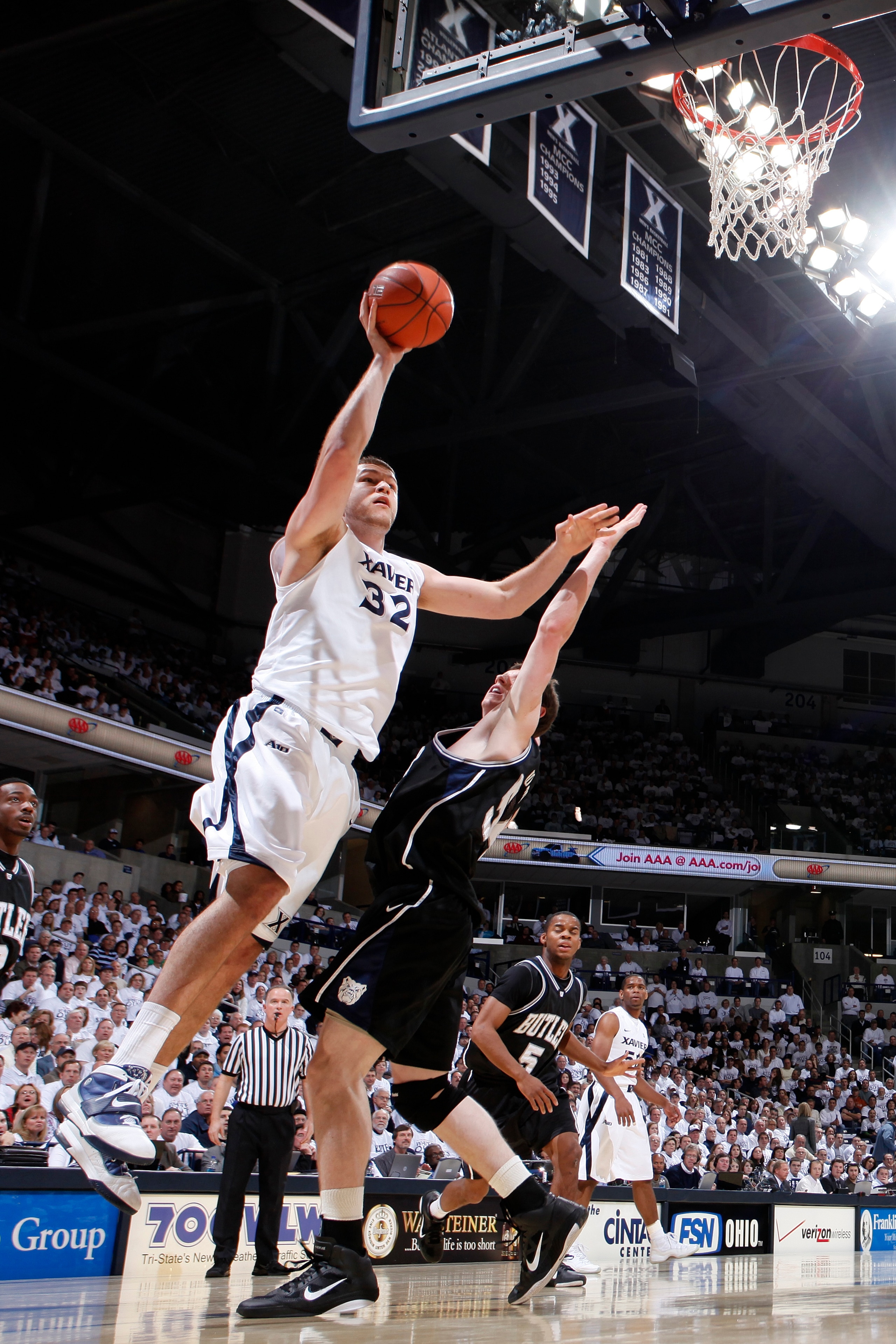 CINCINNATI, OH - DECEMBER 9: Kenny Frease #32 of the Xavier Musketeers goes up for a shot against Matt Howard #54 of the Butler Bulldogs at Cintas Center on December 9, 2010 in Cincinnati, Ohio. Xavier defeated Butler 51-49. (Photo by Joe Robbins/Getty Im