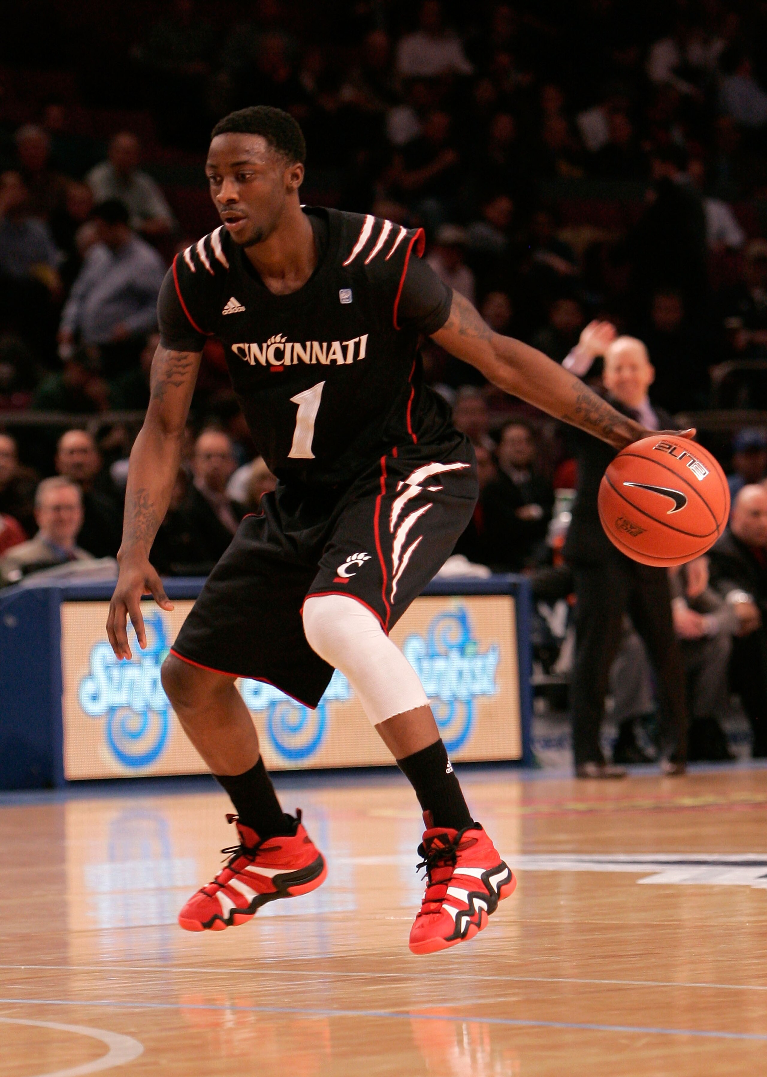 NEW YORK, NY - MARCH 10:  Cashmere Wright #1 of the Cincinnati Bearcats brings the ball up court against the Notre Dame Fighting Irish during the quarterfinals of the 2011 Big East Men's Basketball Tournament presented by American Eagle Outfitters  at Mad