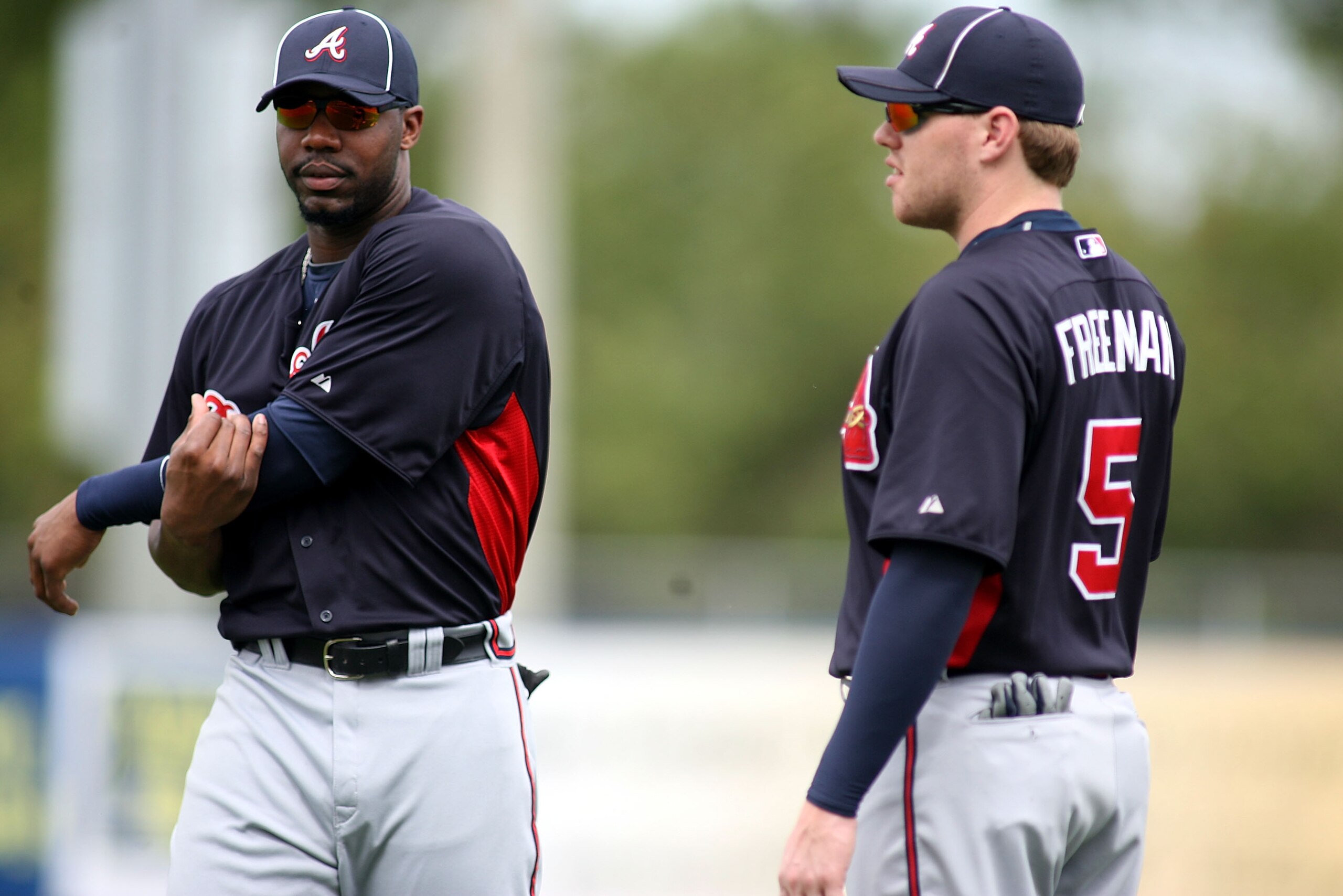 PORT ST. LUCIE, FL - FEBRUARY 26:  Jason Heyward #22 and Freddie Freeman #5 of the Atlanta Braves swarm up prior to playing against the New York Mets at Digital Domain Park on February 26, 2011 in Port St. Lucie, Florida.  (Photo by Marc Serota/Getty Imag