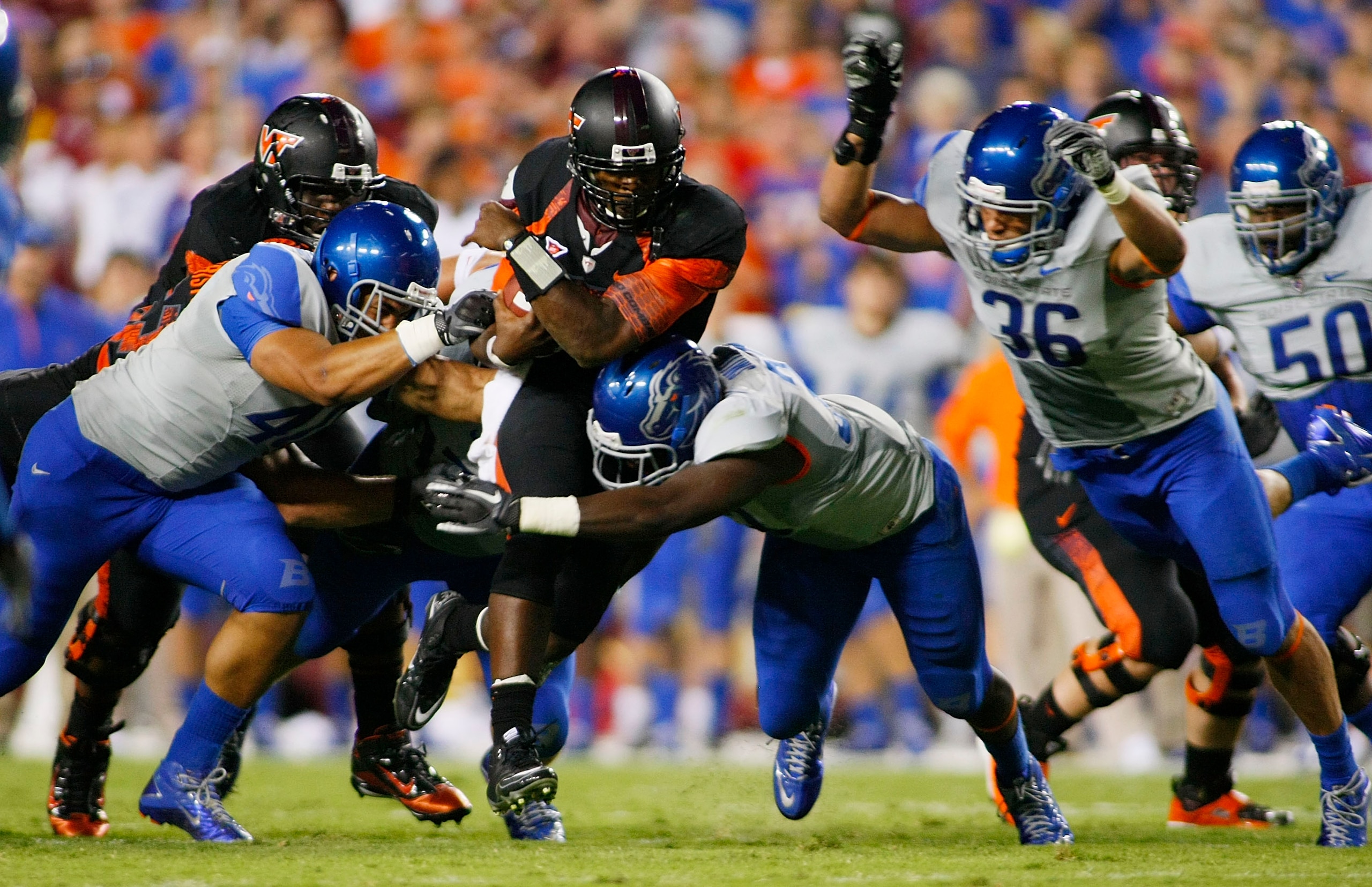 LANDOVER, MD - SEPTEMBER 06: Quarterback #5 Tyrod Taylor of the Virginia Tech Hokies is tackled by defensive end #40 Tyrone Crawford, linebacker #33 Tommy Smith, and linebacker Aaron Tevis of the Boise State Broncos at FedExField on September 6, 2010 in LANDOVER, MD - SEPTEMBER 06: Quarterback #5 Tyrod Taylor of the Virginia Tech Hokies is tackled by defensive end #40 Tyrone Crawford, linebacker #33 Tommy Smith, and linebacker Aaron Tevis of the Boise State Broncos at FedExField on September 6, 2010 in
