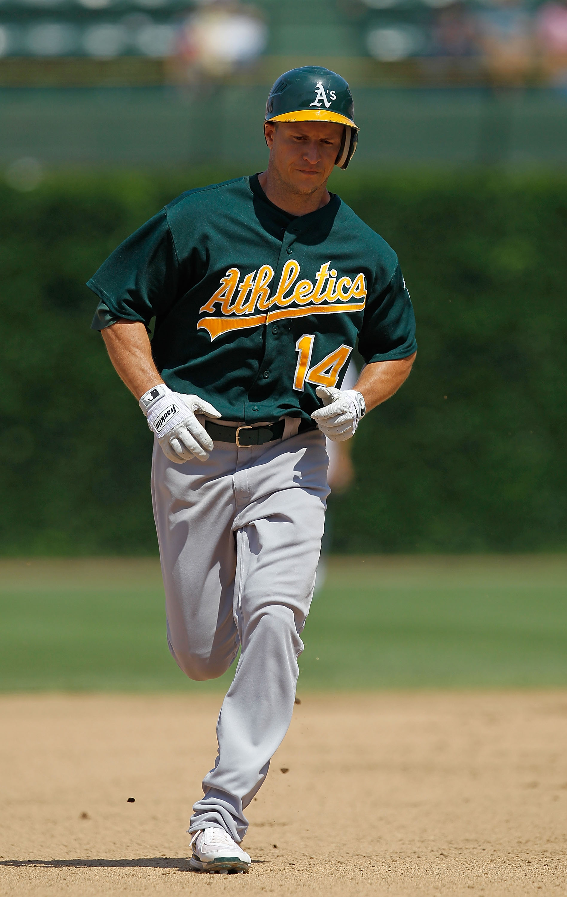 CHICAGO - JUNE 17: Mark Ellis #14 of the Oakland Athletics runs the bases after hitting a home run in the 7th inning against the Chicago Cubs at Wrigley Field on June 17, 2010 in Chicago, Illinois. The Cubs defeated the Athletics 3-2. (Photo by Jonathan D