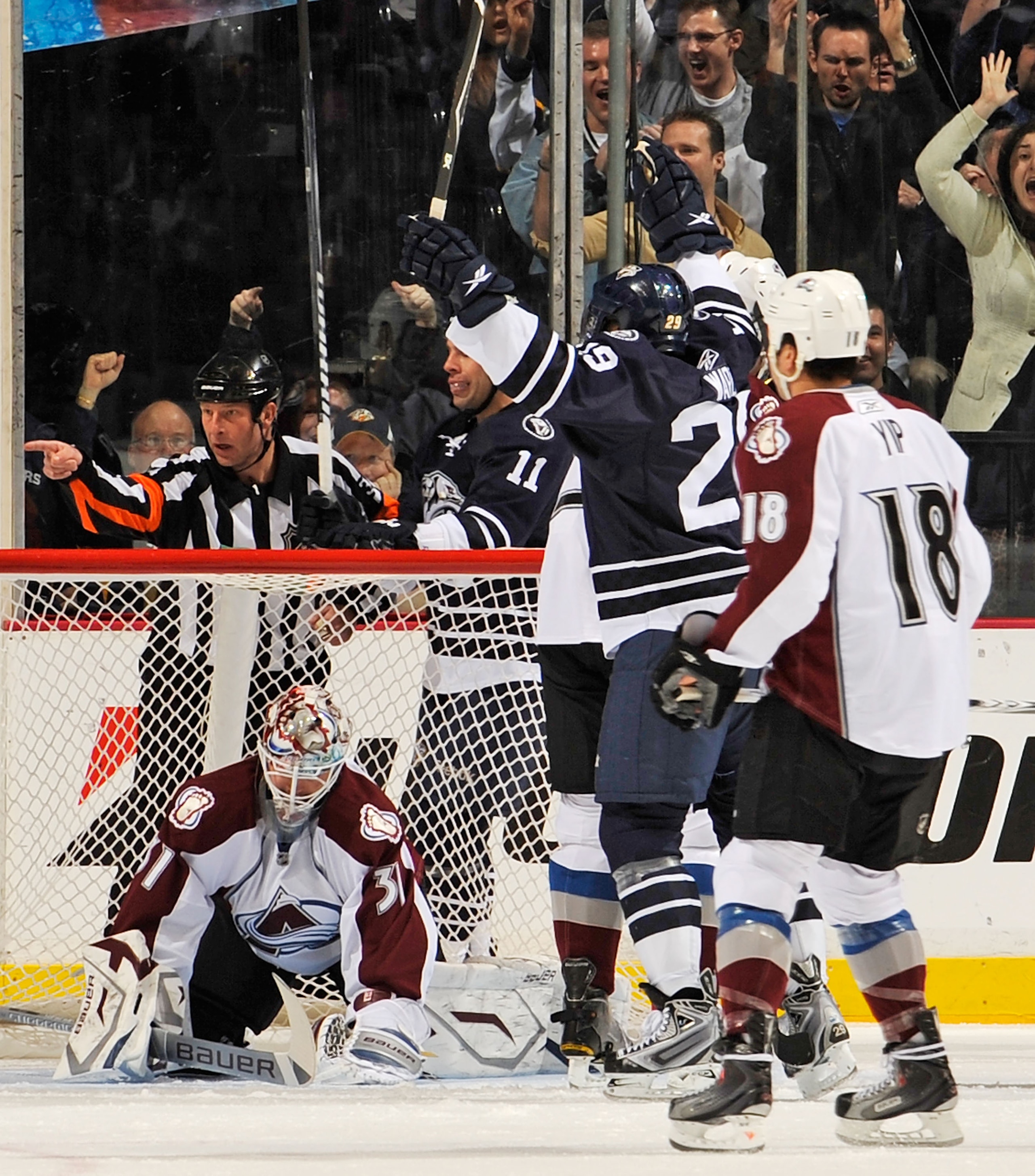 NASHVILLE, TN - MARCH 12:  Joel Waqrd #29 of the Nashville Predators celebrates a goal against Peter Budaj #31 of the Colorado Avalanche on March 12, 2011 at the Bridgestone Arena in Nashville, Tennessee.  (Photo by Frederick Breedon/Getty Images