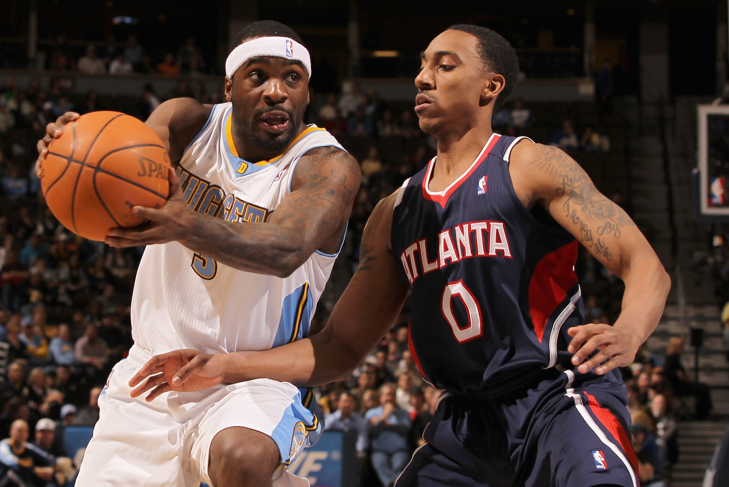 DENVER, CO - FEBRUARY 28:  Ty Lawson #3 of the Denver Nuggets drives the ball against Jeff Teague #0 of the Atlanta Hawks during NBA action at the Pepsi Center on February 28, 2011 in Denver, Colorado. NOTE TO USER: User expressly acknowledges and agrees