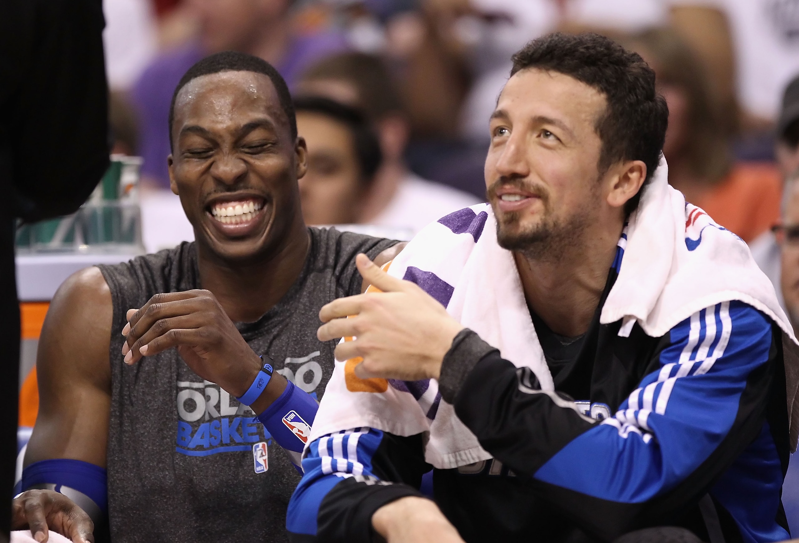 PHOENIX, AZ - MARCH 13:  Dwight Howard #12 and Hedo Turkoglu #15 of the Orlando Magic laugh on the bench during the NBA game against the Phoenix Suns at US Airways Center on March 13, 2011 in Phoenix, Arizona. The Magic defeated the Suns 111-88.  NOTE TO