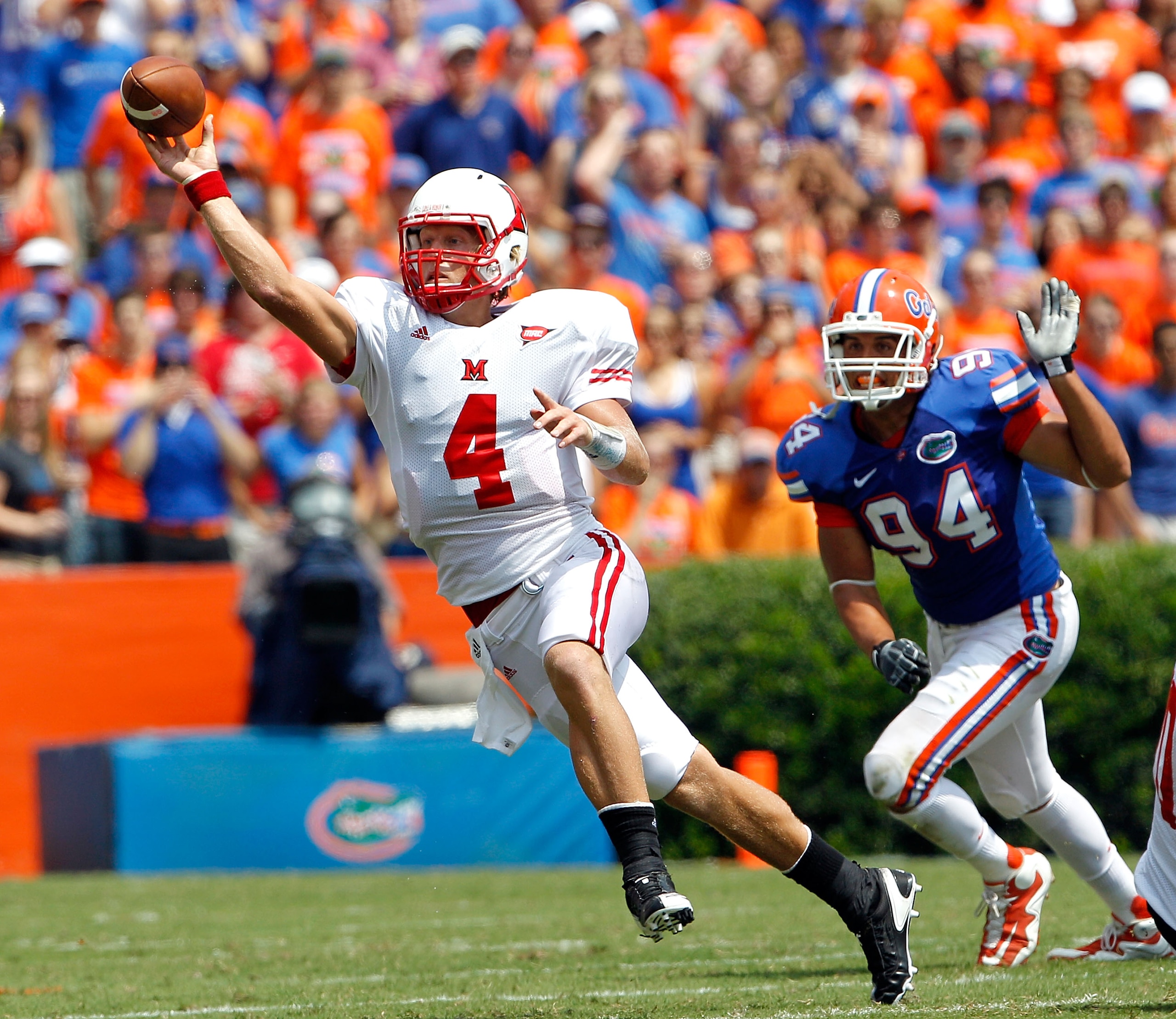 GAINESVILLE, FL - SEPTEMBER 04: Zac Dysert #4 of the Miami University RedHawks attempts a pass while being pressured by Justin Trattou #94 of the Florida Gators at Ben Hill Griffin Stadium on September 4, 2010 in Gainesville, Florida. (Photo by Sam Gree GAINESVILLE, FL - SEPTEMBER 04: Zac Dysert #4 of the Miami University RedHawks attempts a pass while being pressured by Justin Trattou #94 of the Florida Gators at Ben Hill Griffin Stadium on September 4, 2010 in Gainesville, Florida. (Photo by Sam Gree