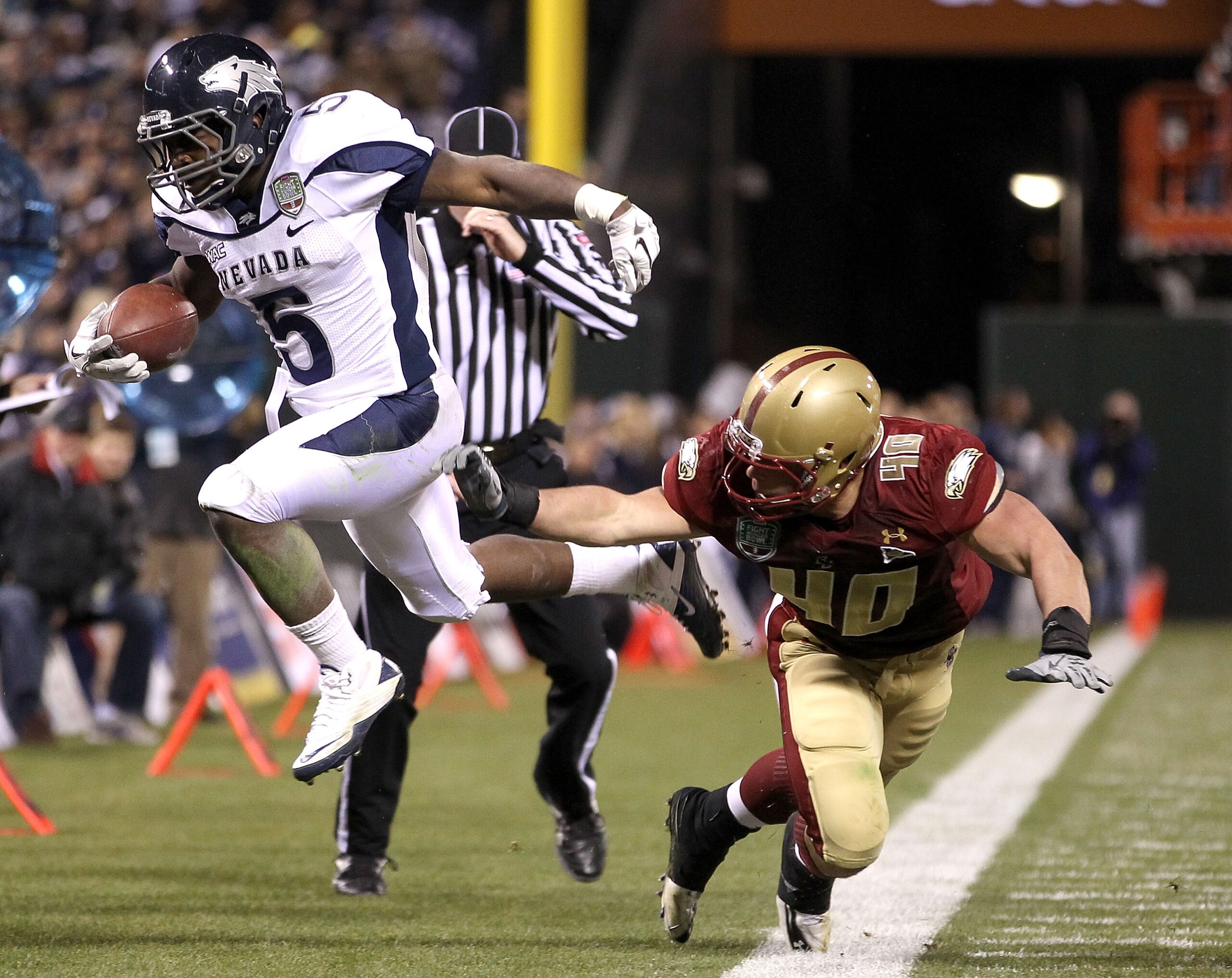 SAN FRANCISCO, CA - JANUARY 09: Mike Ball #5 of the Nevada Wolf Pack is pushed out of bounds by Luke Kuechly #40 of Boston College during the Kraft Fight Hunger Bowl at AT&T Park on January 9, 2011 in San Francisco, California. (Photo by Ezra Shaw/Getty SAN FRANCISCO, CA - JANUARY 09: Mike Ball #5 of the Nevada Wolf Pack is pushed out of bounds by Luke Kuechly #40 of Boston College during the Kraft Fight Hunger Bowl at AT&T Park on January 9, 2011 in San Francisco, California. (Photo by Ezra Shaw/Getty