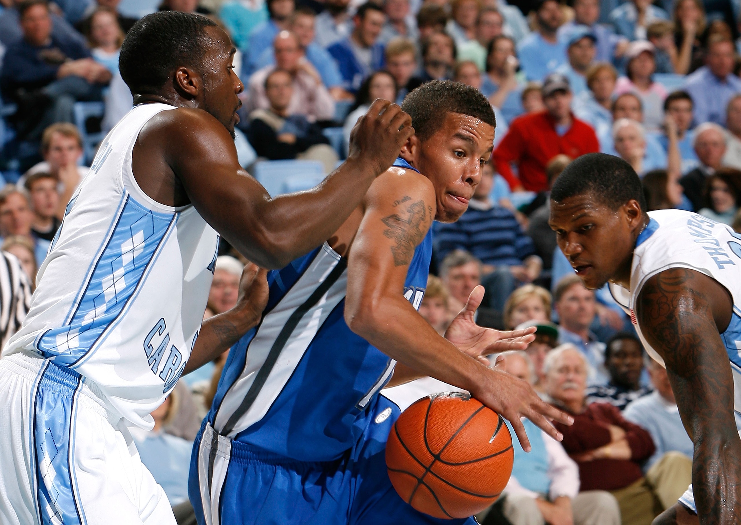 CHAPEL HILL, NC - NOVEMBER 30:  Ty Lawson #5 of the North Carolina Tar Heels defends as Deon Thompson #21 strips the ball from J.P. Primm #10 of the UNC Asheville Bulldogs during the game at the Dean E. Smith Center on November 30, 2008 in Chapel Hill, No