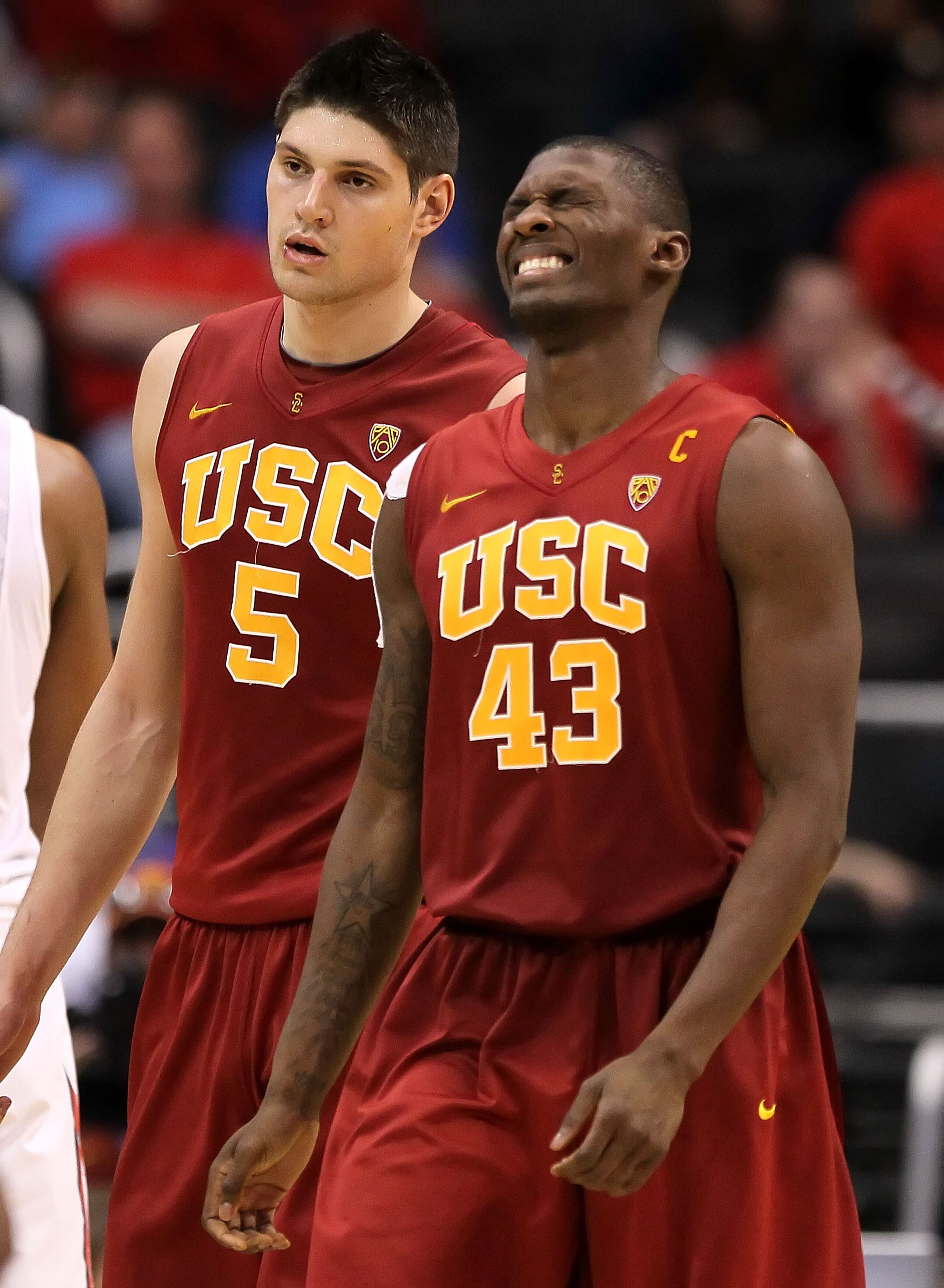 LOS ANGELES, CA - MARCH 11:  Nikola Vucevic #5 and Marcus Simmons #43 of the USC Trojans react late in the second half while taking on the Arizona Wildcats in the semifinals of the 2011 Pacific Life Pac-10 Men's Basketball Tournament at Staples Center on