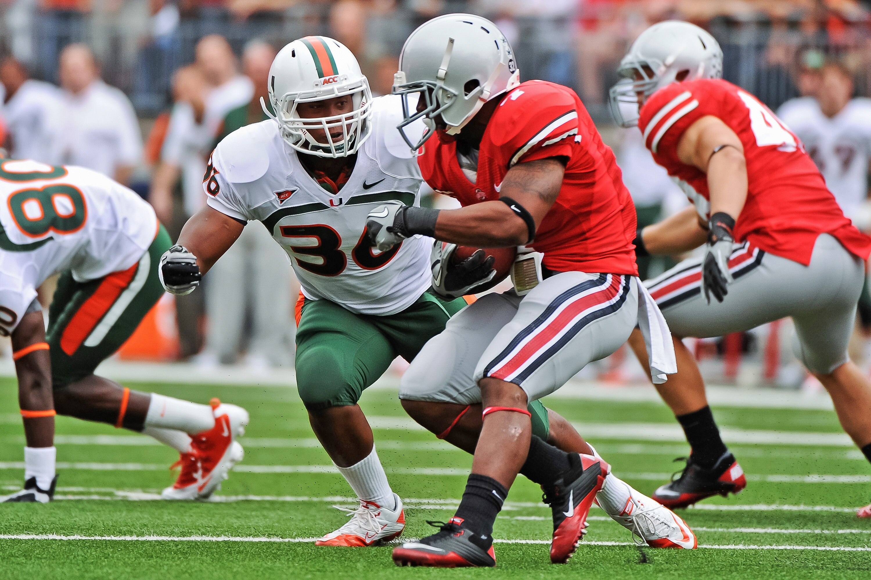 COLUMBUS, OH - SEPTEMBER 11:  Kylan Robinson #36 of the Miami Hurricanes tackles Jordan Hall #7 of the Ohio State Buckeyes  at Ohio Stadium on September 11, 2010 in Columbus, Ohio.  (Photo by Jamie Sabau/Getty Images)