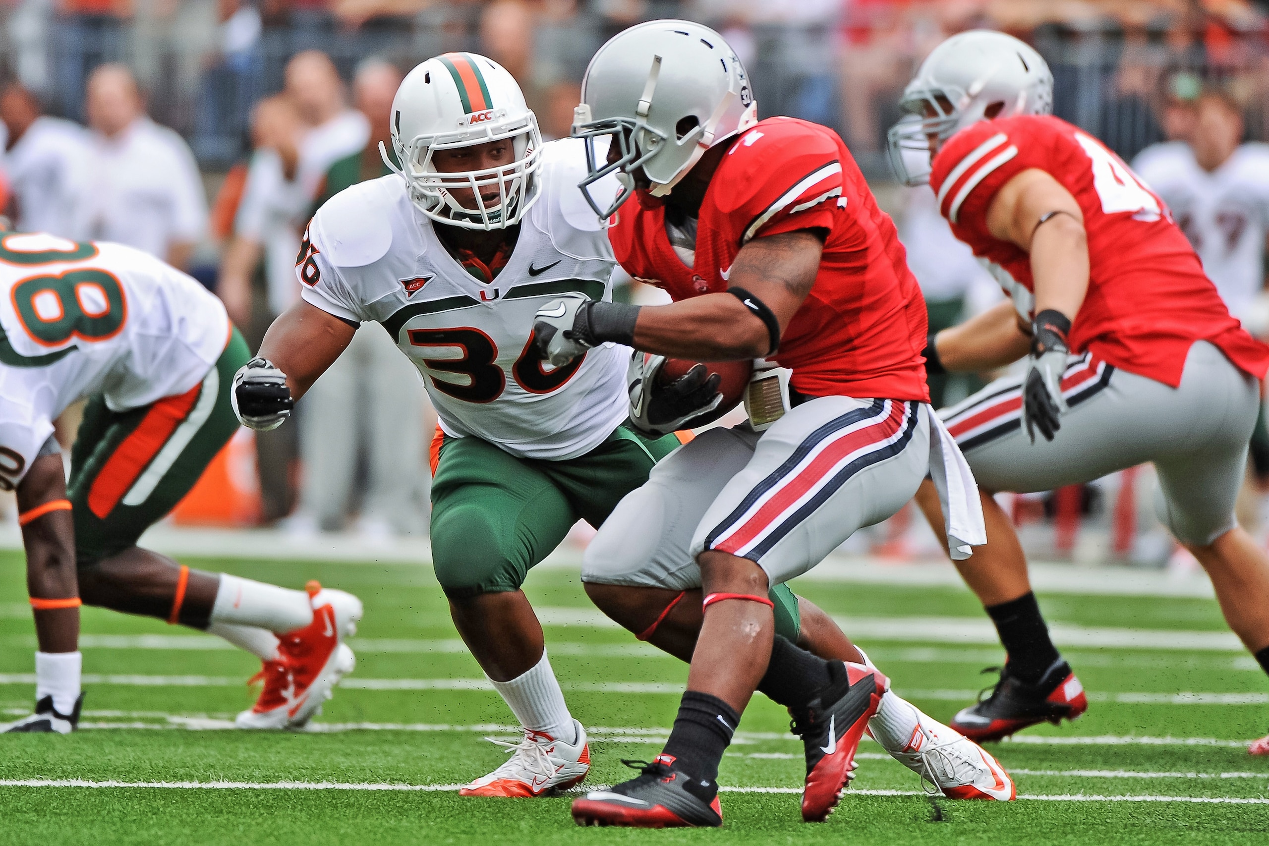 COLUMBUS, OH - SEPTEMBER 11: Kylan Robinson #36 of the Miami Hurricanes tackles Jordan Hall #7 of the Ohio State Buckeyes at Ohio Stadium on September 11, 2010 in Columbus, Ohio. (Photo by Jamie Sabau/Getty Images) COLUMBUS, OH - SEPTEMBER 11: Kylan Robinson #36 of the Miami Hurricanes tackles Jordan Hall #7 of the Ohio State Buckeyes at Ohio Stadium on September 11, 2010 in Columbus, Ohio. (Photo by Jamie Sabau/Getty Images)
