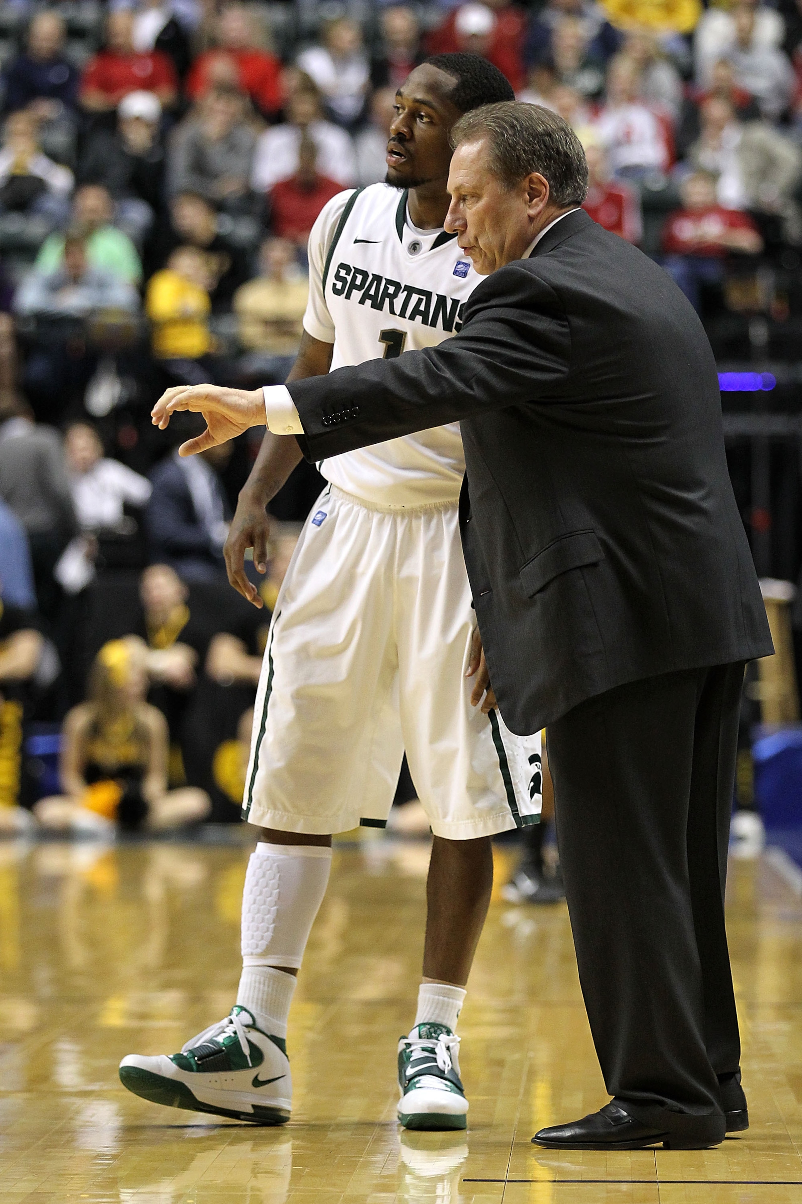 INDIANAPOLIS, IN - MARCH 10: Head coach Tom Izzo and Kalin Lucas #1 of the Michigan State Spartans talk on the sideline against the Iowa Hawkeyes during the first round of the 2011 Big Ten Men's Basketball Tournament at Conseco Fieldhouse on March 10, 20 INDIANAPOLIS, IN - MARCH 10: Head coach Tom Izzo and Kalin Lucas #1 of the Michigan State Spartans talk on the sideline against the Iowa Hawkeyes during the first round of the 2011 Big Ten Men's Basketball Tournament at Conseco Fieldhouse on March 10, 20