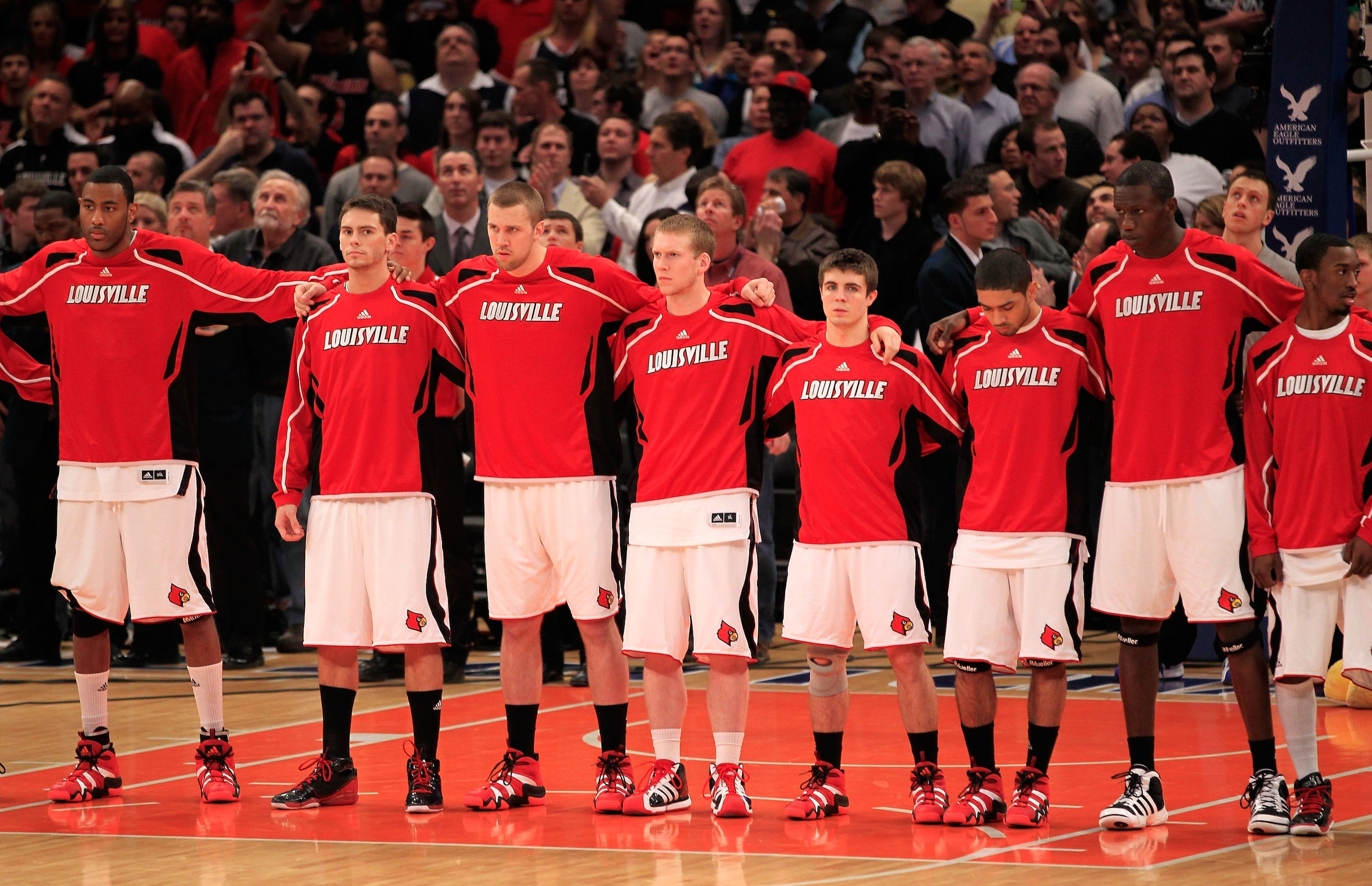 NEW YORK, NY - MARCH 12: The Louisville Cardinals look on during the National Anthem before their game against the Connecticut Huskies during the championship of the 2011 Big East Men's Basketball Tournament presented by American Eagle Outfitters at Madis NEW YORK, NY - MARCH 12: The Louisville Cardinals look on during the National Anthem before their game against the Connecticut Huskies during the championship of the 2011 Big East Men's Basketball Tournament presented by American Eagle Outfitters at Madis