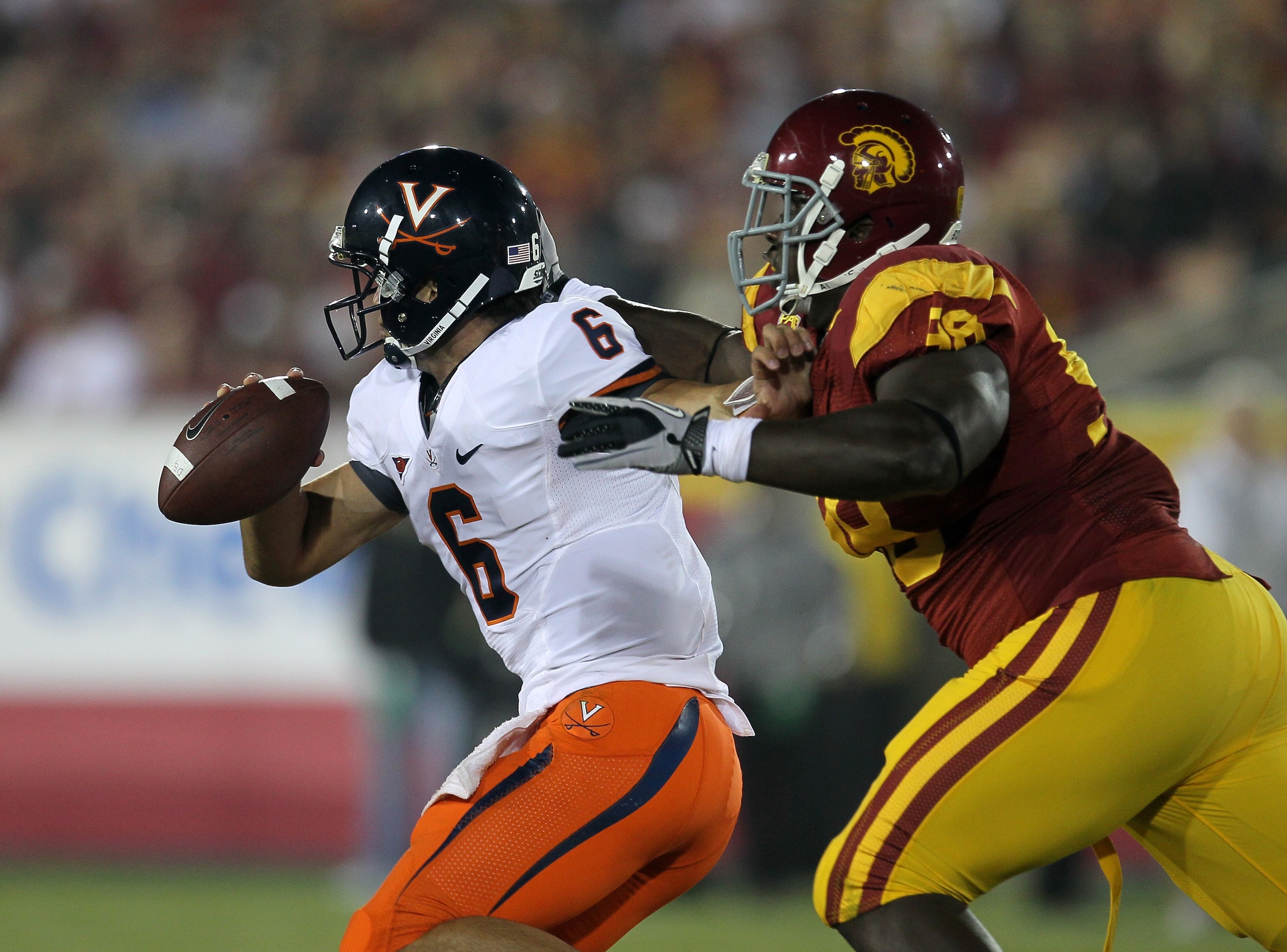 LOS ANGELES - SEPTEMBER 11: Defensive lineman DaJohn Harris #98 of the USC Trojans sacks quarterback Marc Verica #6 of the Virginia Cavaliers at Los Angeles Memorial Coliseum on September 11, 2010 in Los Angeles, California. USC won 17-14. (Photo by Ste LOS ANGELES - SEPTEMBER 11: Defensive lineman DaJohn Harris #98 of the USC Trojans sacks quarterback Marc Verica #6 of the Virginia Cavaliers at Los Angeles Memorial Coliseum on September 11, 2010 in Los Angeles, California. USC won 17-14. (Photo by Ste