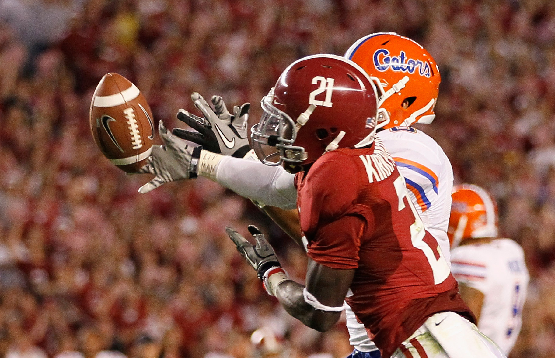 TUSCALOOSA, AL - OCTOBER 02:  Dre Kirkpatrick #21 of the Alabama Crimson Tide intercepts a pass intended for Trey Burton #8 of the Florida Gators at Bryant-Denny Stadium on October 2, 2010 in Tuscaloosa, Alabama.  (Photo by Kevin C. Cox/Getty Images)