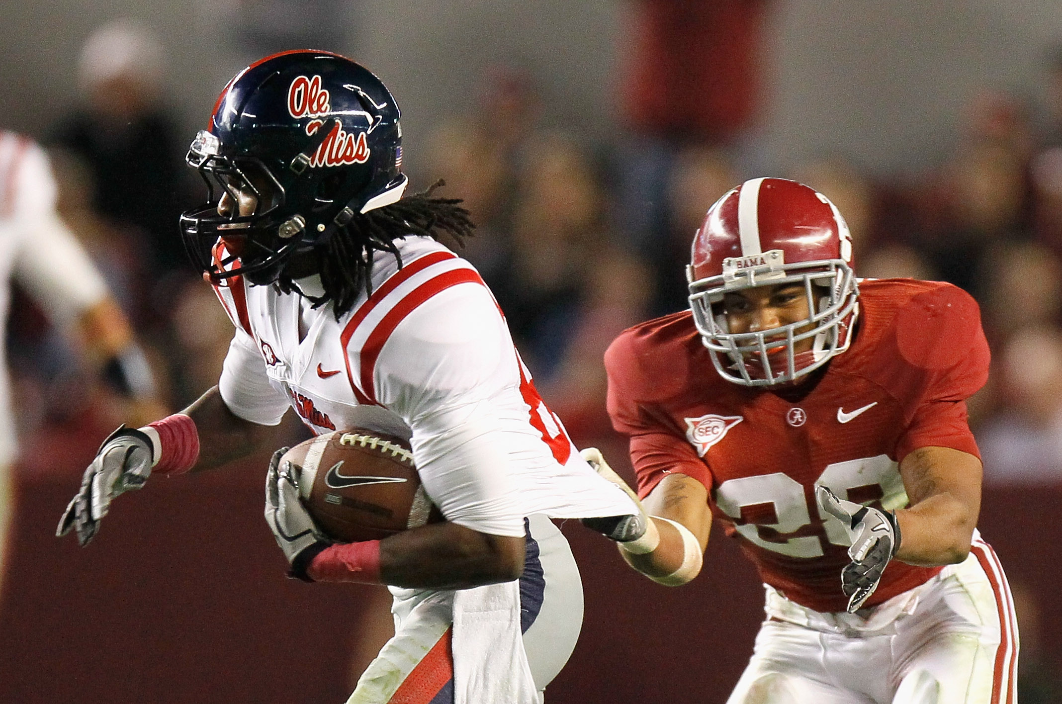 TUSCALOOSA, AL - OCTOBER 16:  DeMarcus Milliner #28 of the Alabama Crimson Tide grabs the jersey of Ja'mes Logan #85 of the Ole Miss Rebels at Bryant-Denny Stadium on October 16, 2010 in Tuscaloosa, Alabama.  (Photo by Kevin C. Cox/Getty Images)
