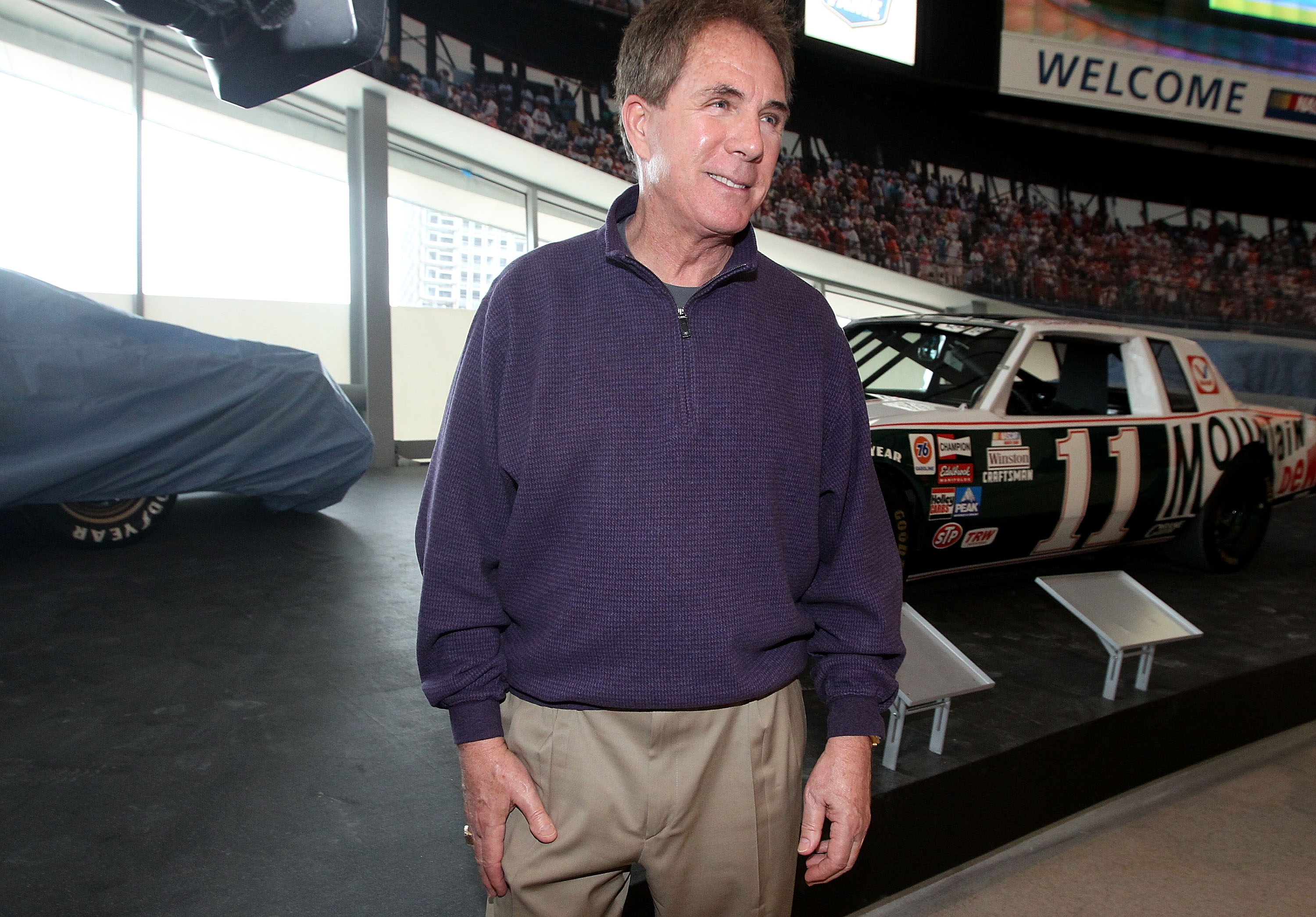 CHARLOTTE, NC - MARCH 22:  Darrell Waltrip stands with his Championship-winning No. 11 Mountain Dew Buick during the kick off of the final 50 days before the opening of the NASCAR Hall of Fame at the NASCAR Hall of Fame on March 22, 2010 in Charlotte, Nor