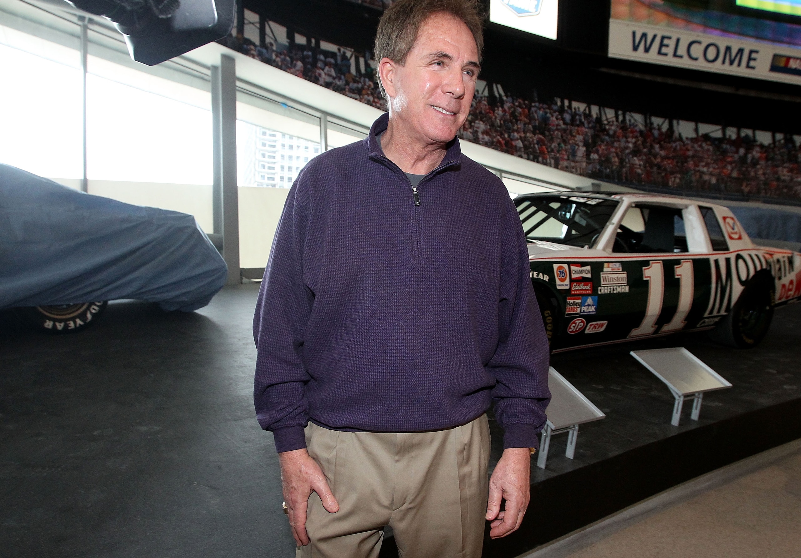 CHARLOTTE, NC - MARCH 22:  Darrell Waltrip stands with his Championship-winning No. 11 Mountain Dew Buick during the kick off of the final 50 days before the opening of the NASCAR Hall of Fame at the NASCAR Hall of Fame on March 22, 2010 in Charlotte, Nor