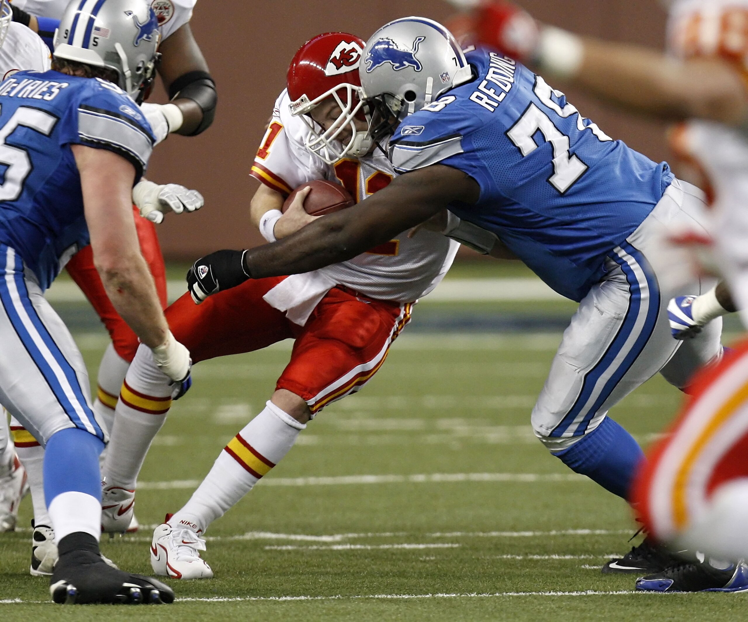 DETROIT , MI - DECEMBER 23:  Damon Huard #11 of the Kansas City Chiefs is sacked by Cory Redding #78 of the Detroit Lions on December 23, 2007 at Ford Field in Detroit, Michigan. (Photo by Gregory Shamus/Getty Images)