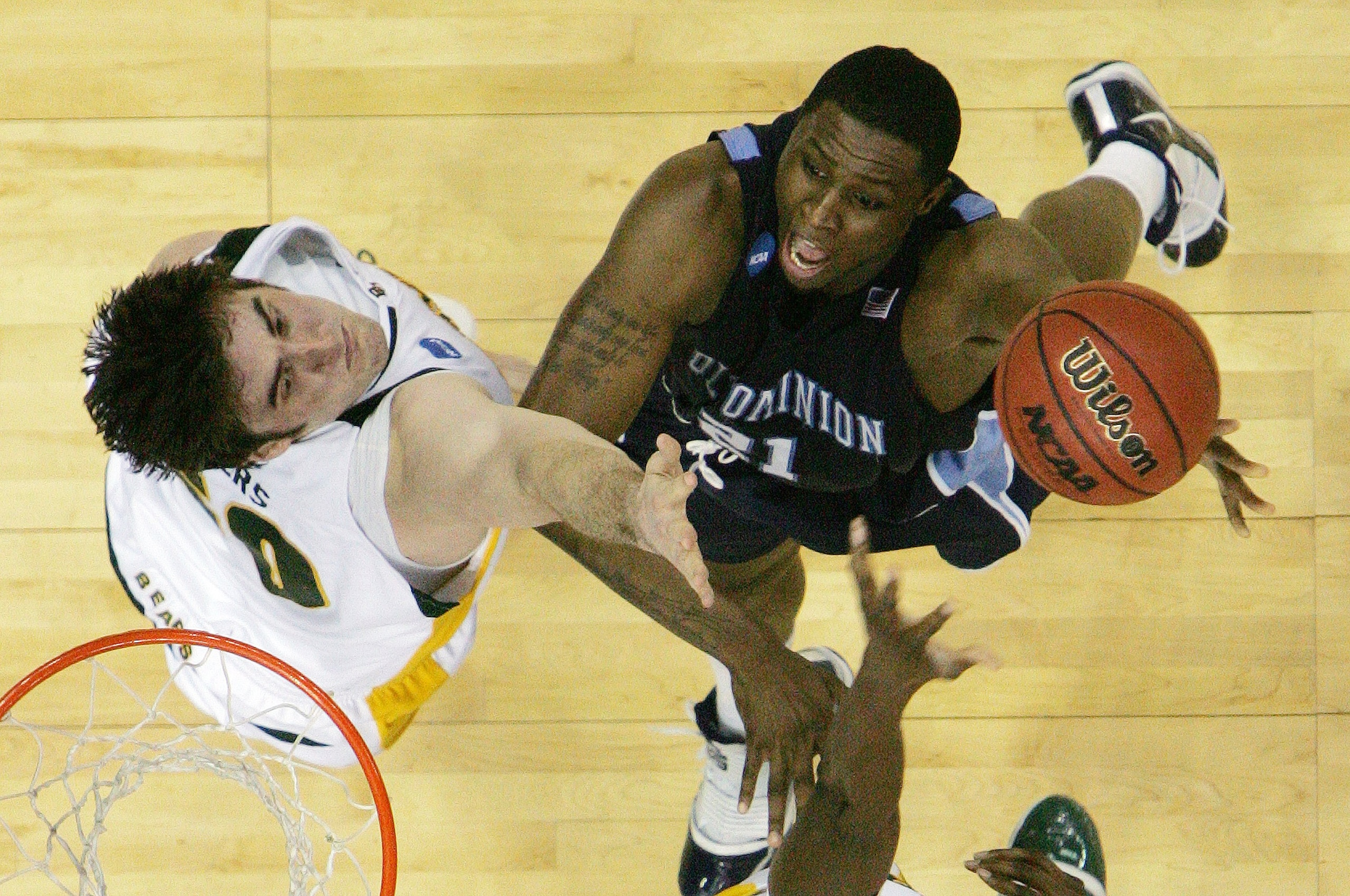 NEW ORLEANS - MARCH 20:  Frank Hassell #21 of the Old Dominion Monarchs scores against Josh Lomers #50 of the Baylor Bears during the second round of the 2010 NCAA men's basketball tournament at the New Orleans Arena on March 20, 2010 in New Orleans, Loui
