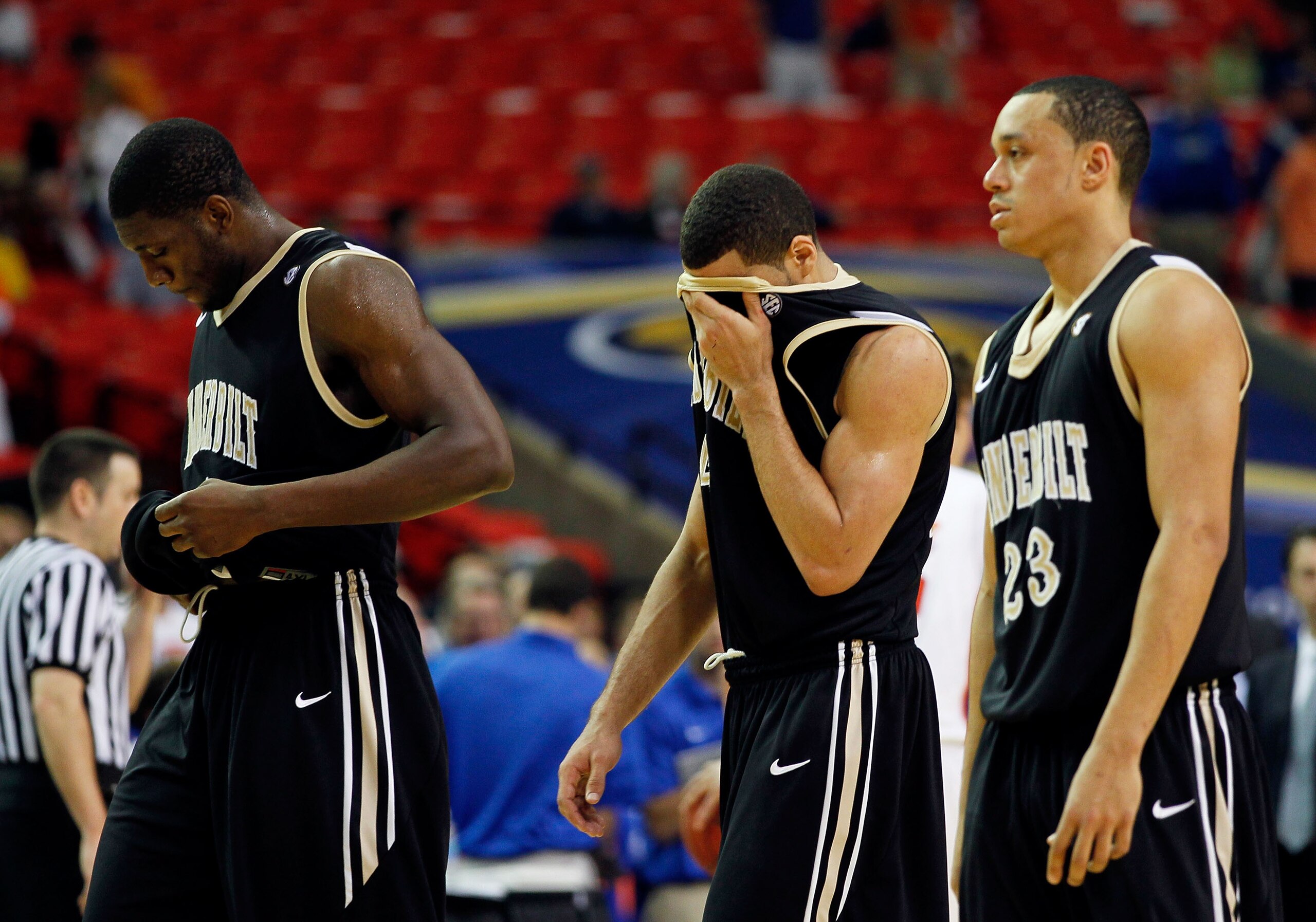 ATLANTA, GA - MARCH 12:  Lance Goulbourne #5, Festus Ezeli #3 and John Jenkins #23 of the Vanderbilt Commodores walk off of the court dejected after loosing to the Florida Gators 77 to 66 during the semifinals of the SEC Men's Basketball Tournament at Geo