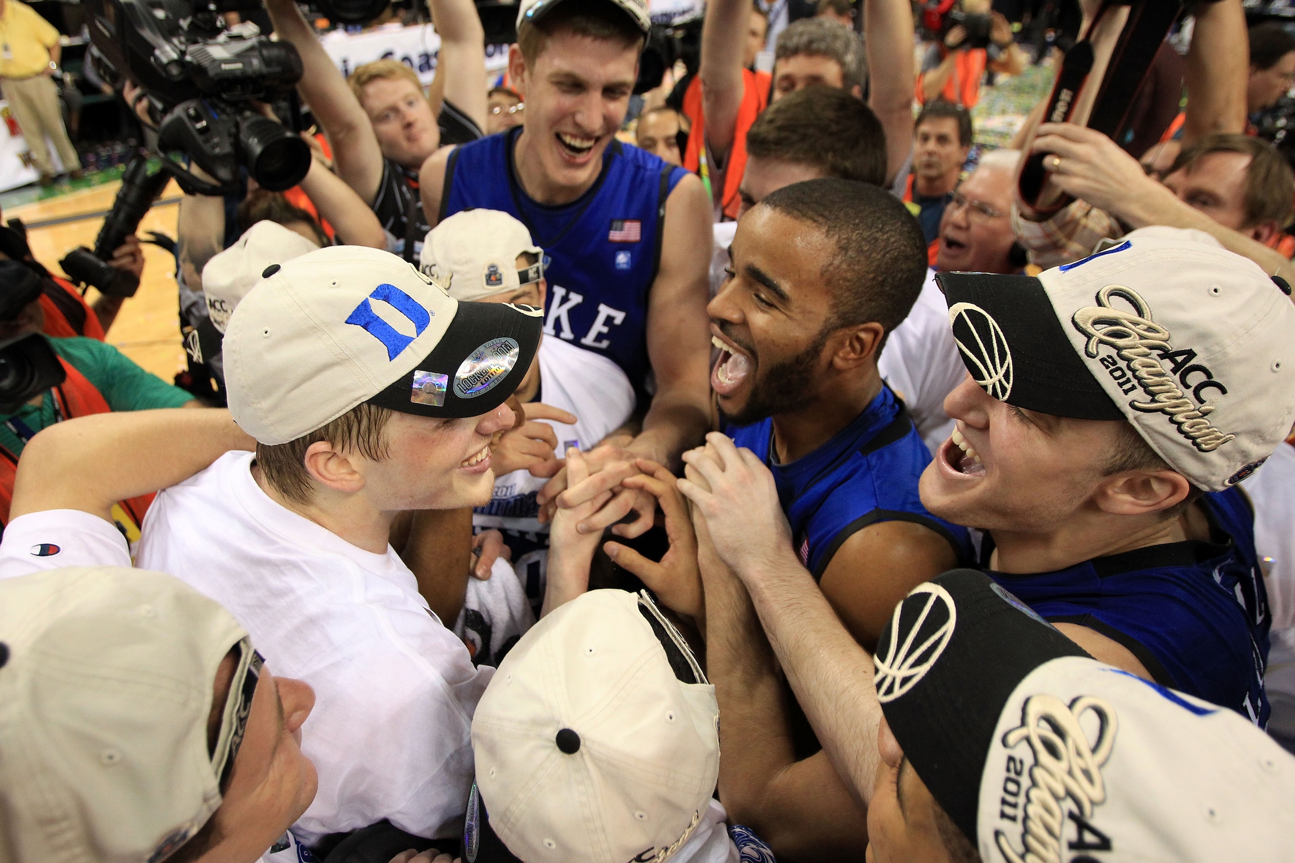 GREENSBORO, NC - MARCH 13:  The Duke Blue Devils celebrate after their 75-58 victory over the North Carolina Tar Heels to win the championship game of the 2011 ACC men's basketball tournament at the Greensboro Coliseum on March 13, 2011 in Greensboro, Nor