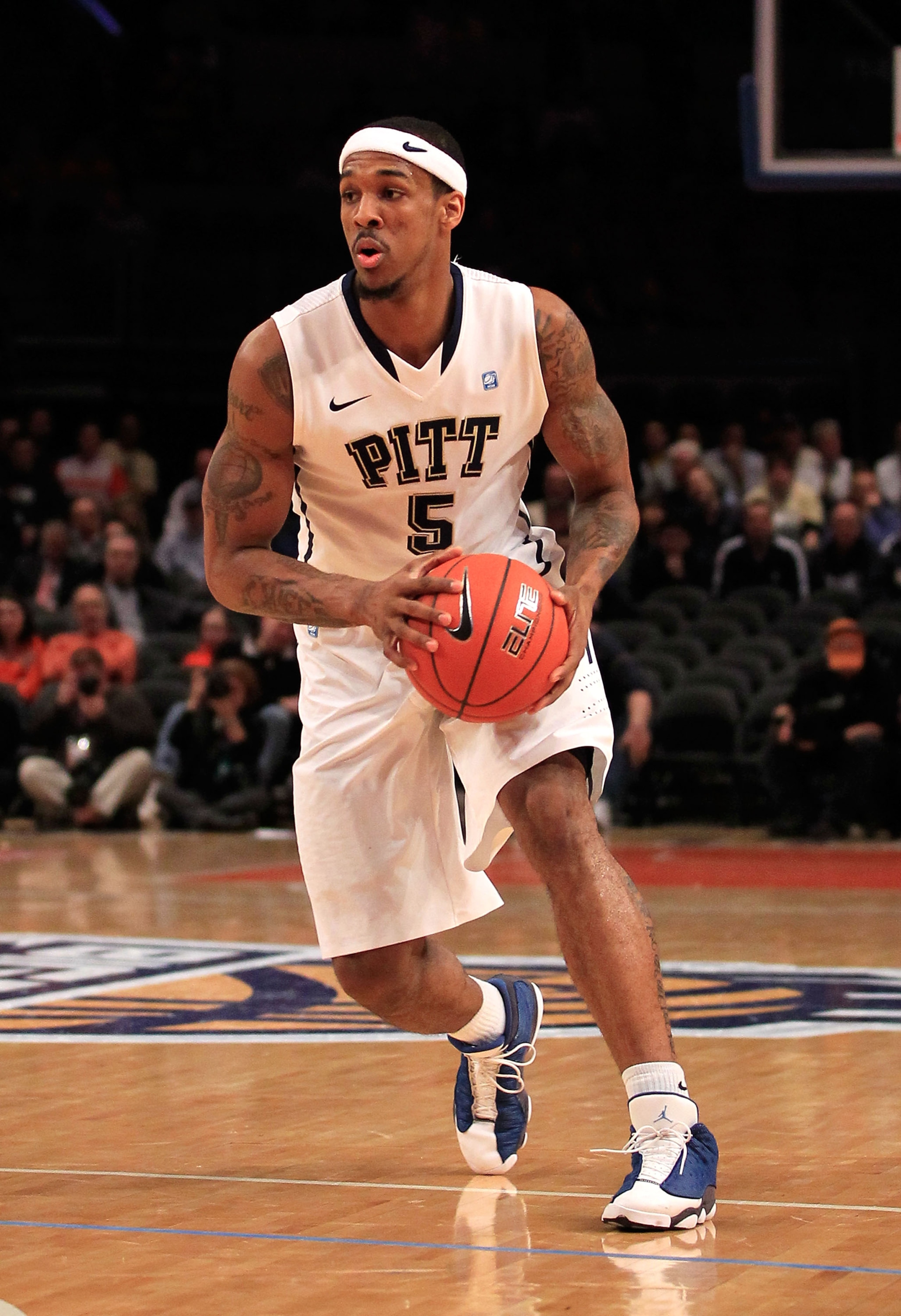 NEW YORK, NY - MARCH 10: Gilbert Brown #5 of the Pittsburgh Panthers brings the ball up court against the Connecticut Huskies during the quarterfinals of the 2011 Big East Men's Basketball Tournament presented by American Eagle Outfitters  at Madison Squa