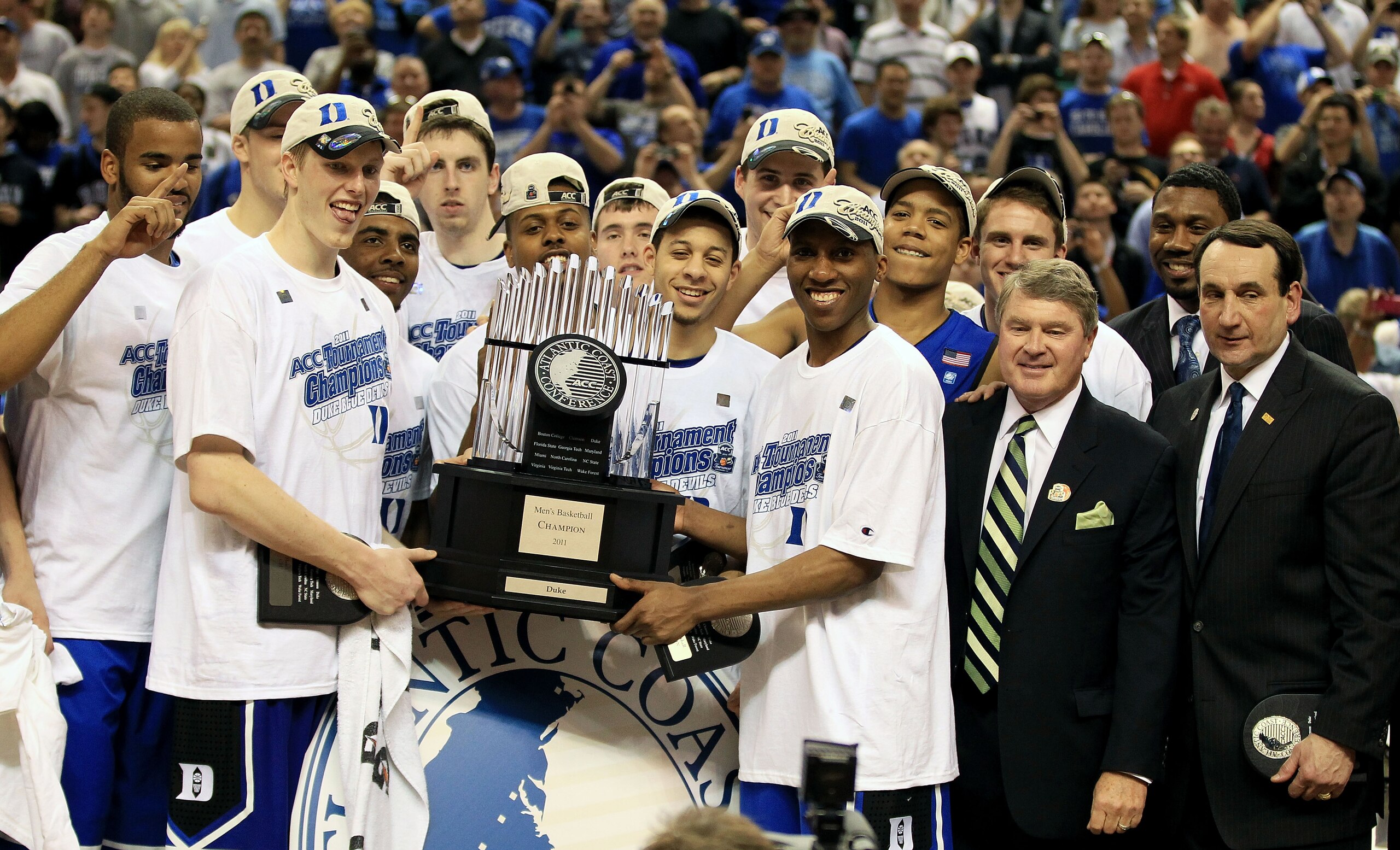GREENSBORO, NC - MARCH 13:  The Duke Blue Devils celebrate with the ACC Championship Trophy after their 75-58 victory over the North Carolina Tar Heels in the championship game of the 2011 ACC men's basketball tournament at the Greensboro Coliseum on Marc