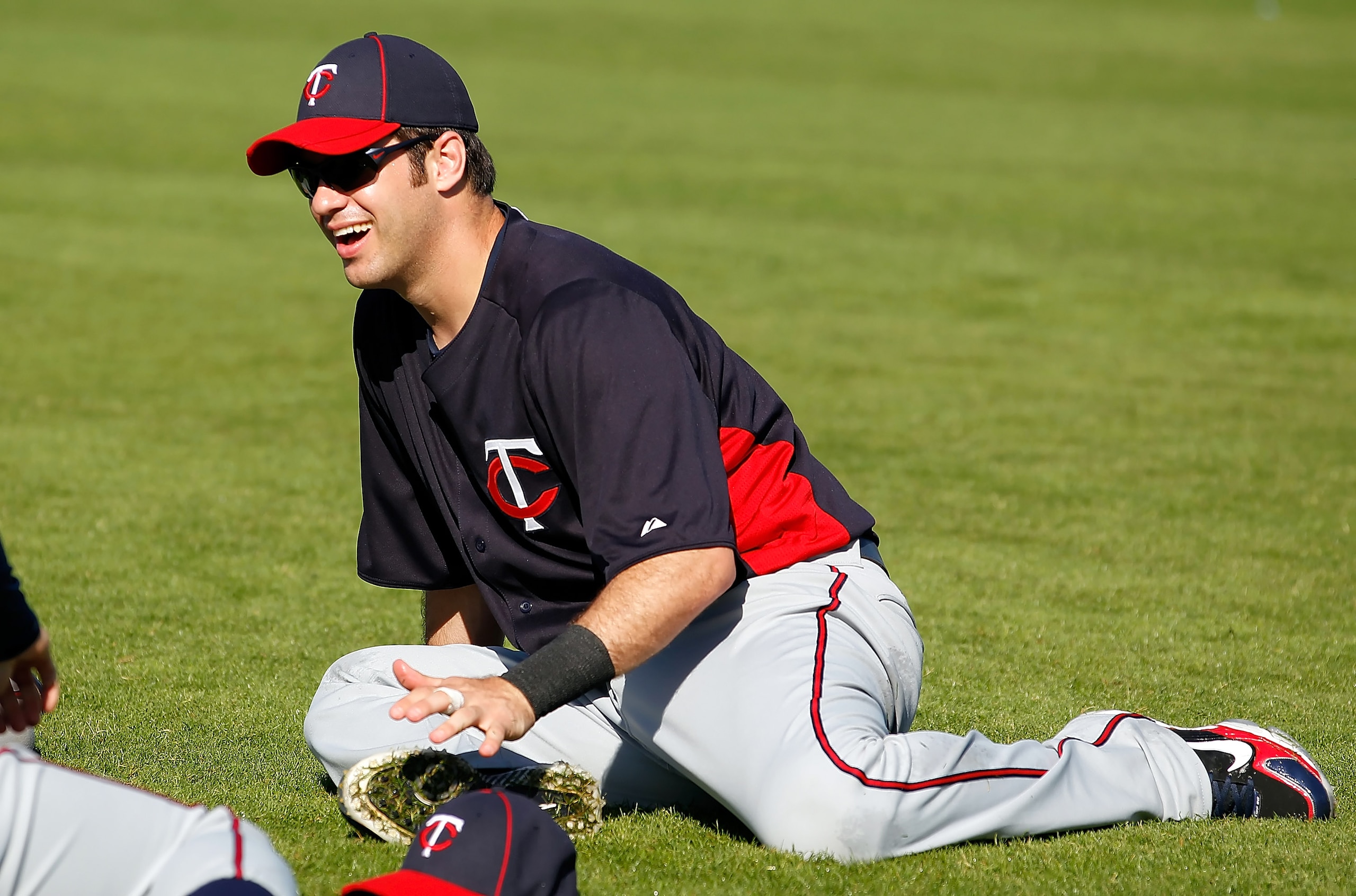 FORT MYERS, FL - FEBRUARY 23:  Catcher Joe Mauer #7 of the Minnesota Twins stretches during a spring training workout session at Hammond Stadium on February 23, 2011 in Fort Myers, Florida.  (Photo by J. Meric/Getty Images)