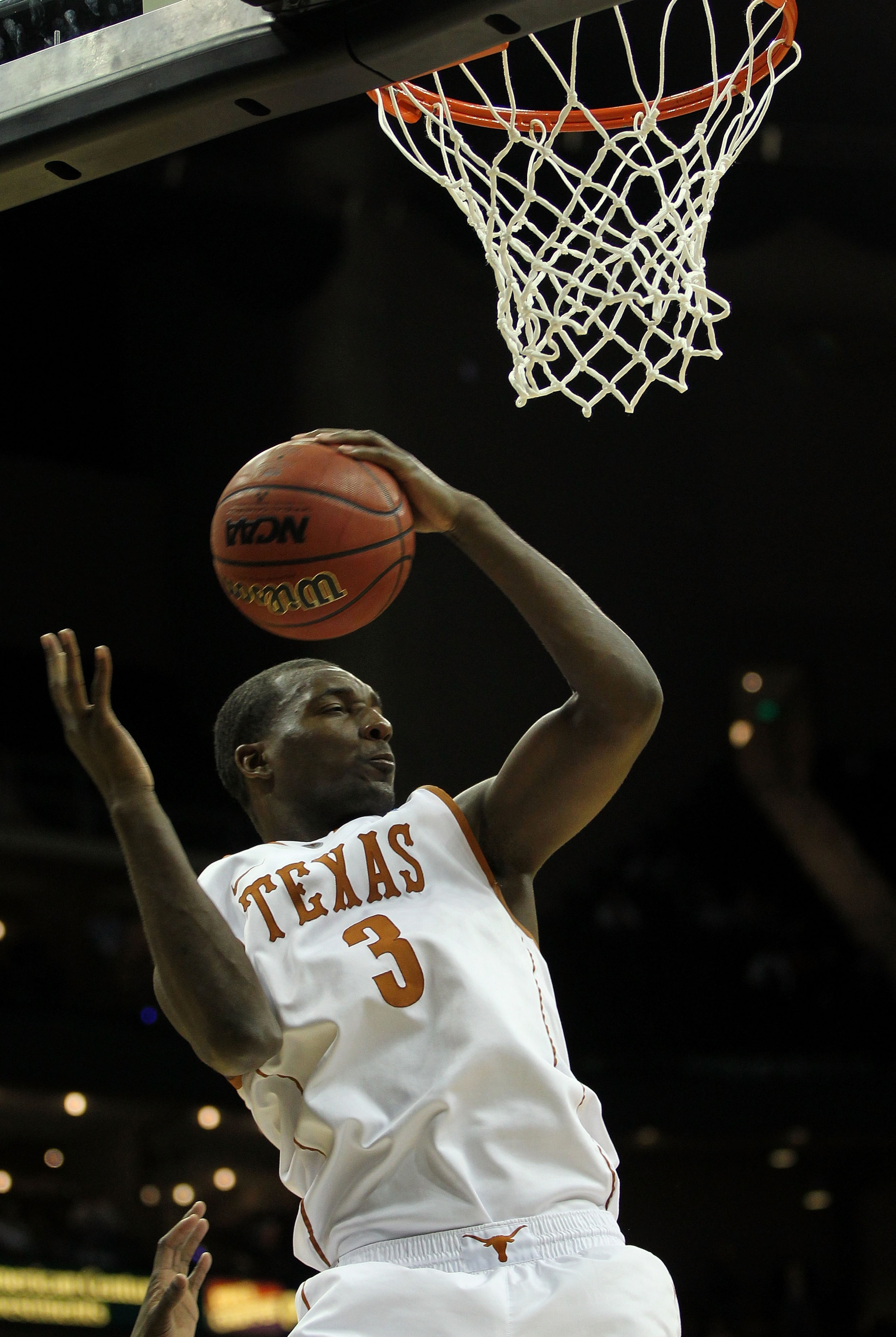 KANSAS CITY, MO - MARCH 11:  Jordan Hamilton #3 of the Texas Longhorns grabs a rebound against the Texas A&M Aggies during their semifinal game in the 2011 Phillips 66 Big 12 Men's Basketball Tournament at Sprint Center on March 11, 2011 in Kansas City, M