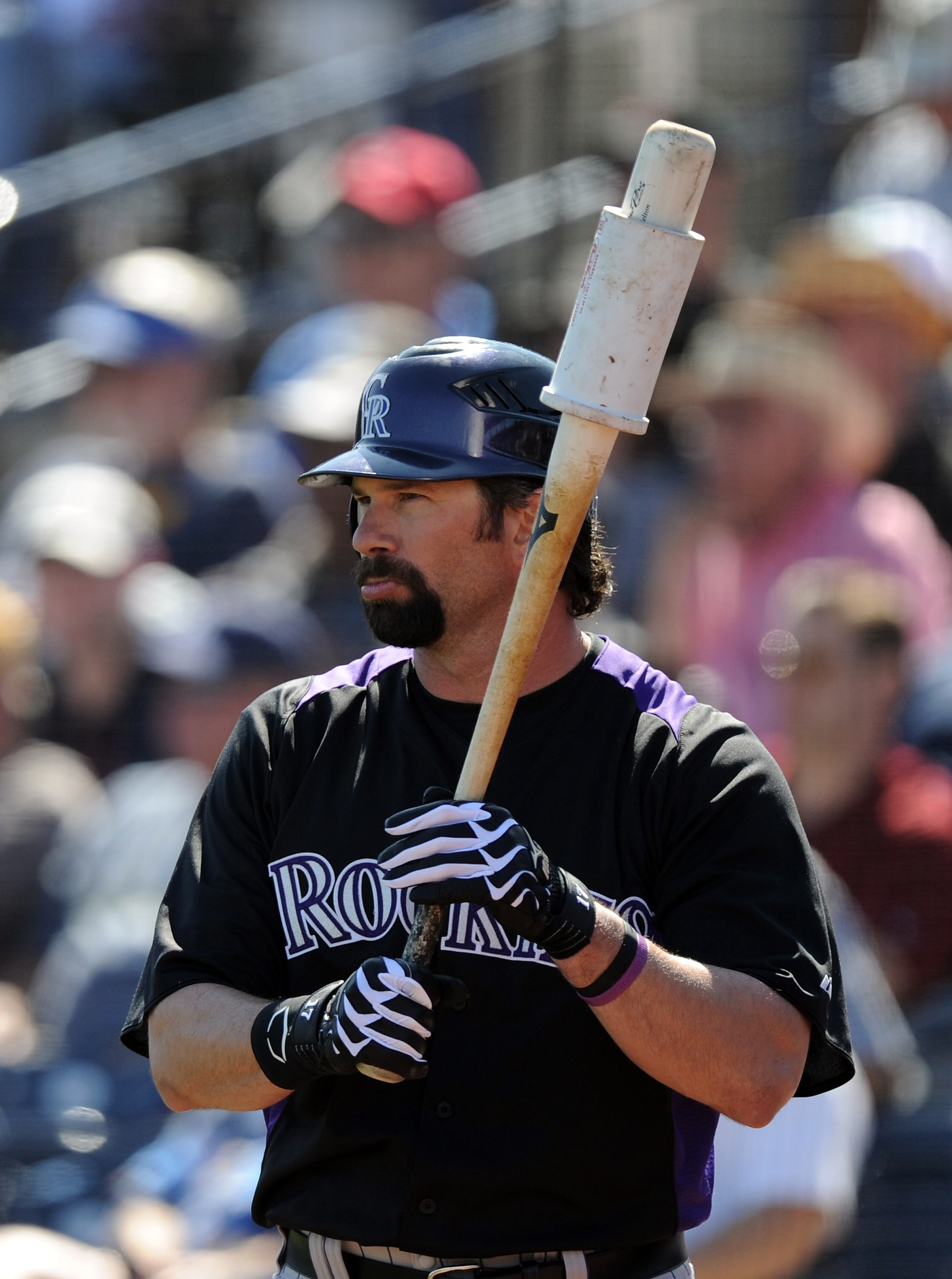 PEORIA, AZ - MARCH 02:  Todd Helton #17 of the Colorado Rockies at bat against the San Diego Padres during spring training at Peoria Stadium on March 2, 2011 in Peoria, Arizona.  (Photo by Harry How/Getty Images)