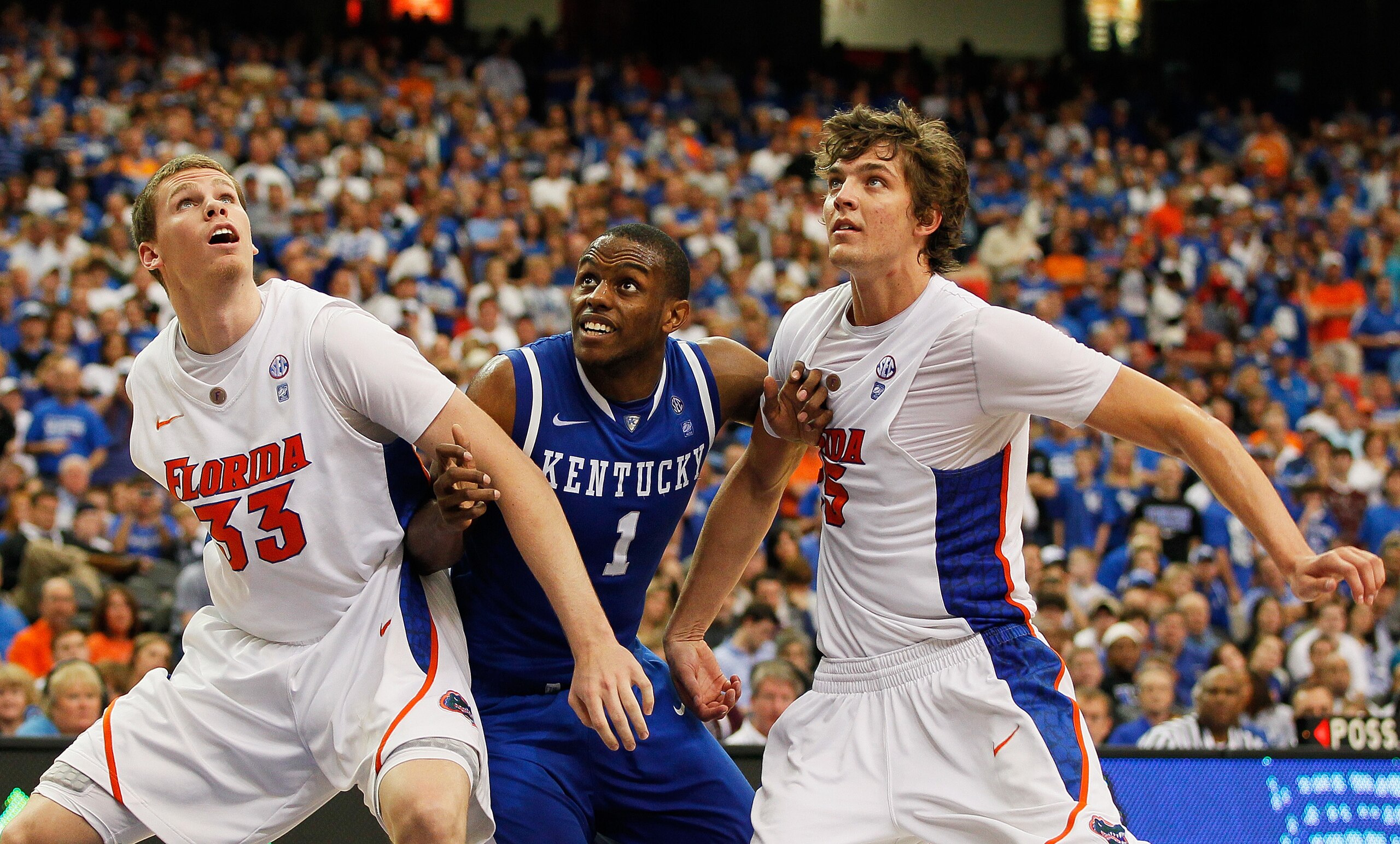 ATLANTA, GA - MARCH 13:  Darius Miller #1 of the Kentucky Wildcats fights for position between Erik Murphy #33 and Chandler Parsons #25 of the Florida Gators during the championship game of the SEC Men's Basketball Tournament at Georgia Dome on March 13,