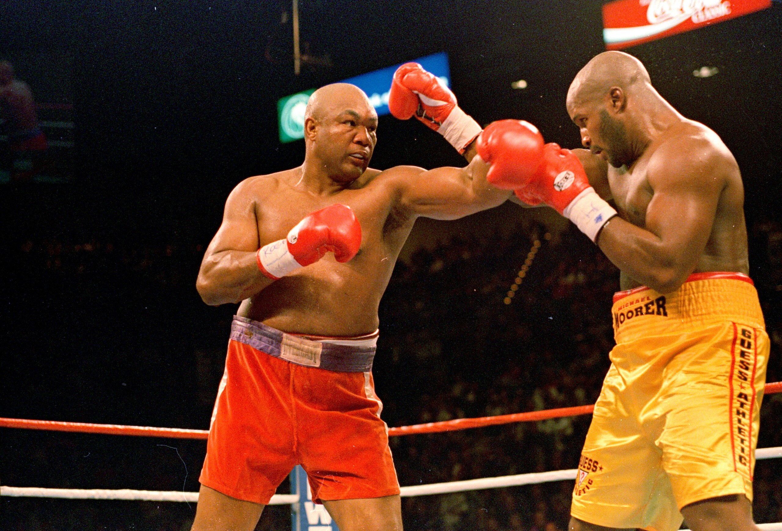 5 Nov 1995:  George Foreman trows a left punch at Michael Moorer during the fight in Las Vegas. Forman wins by a knock out in round 10. Mandatory Credit: Al Bello  /Allsport