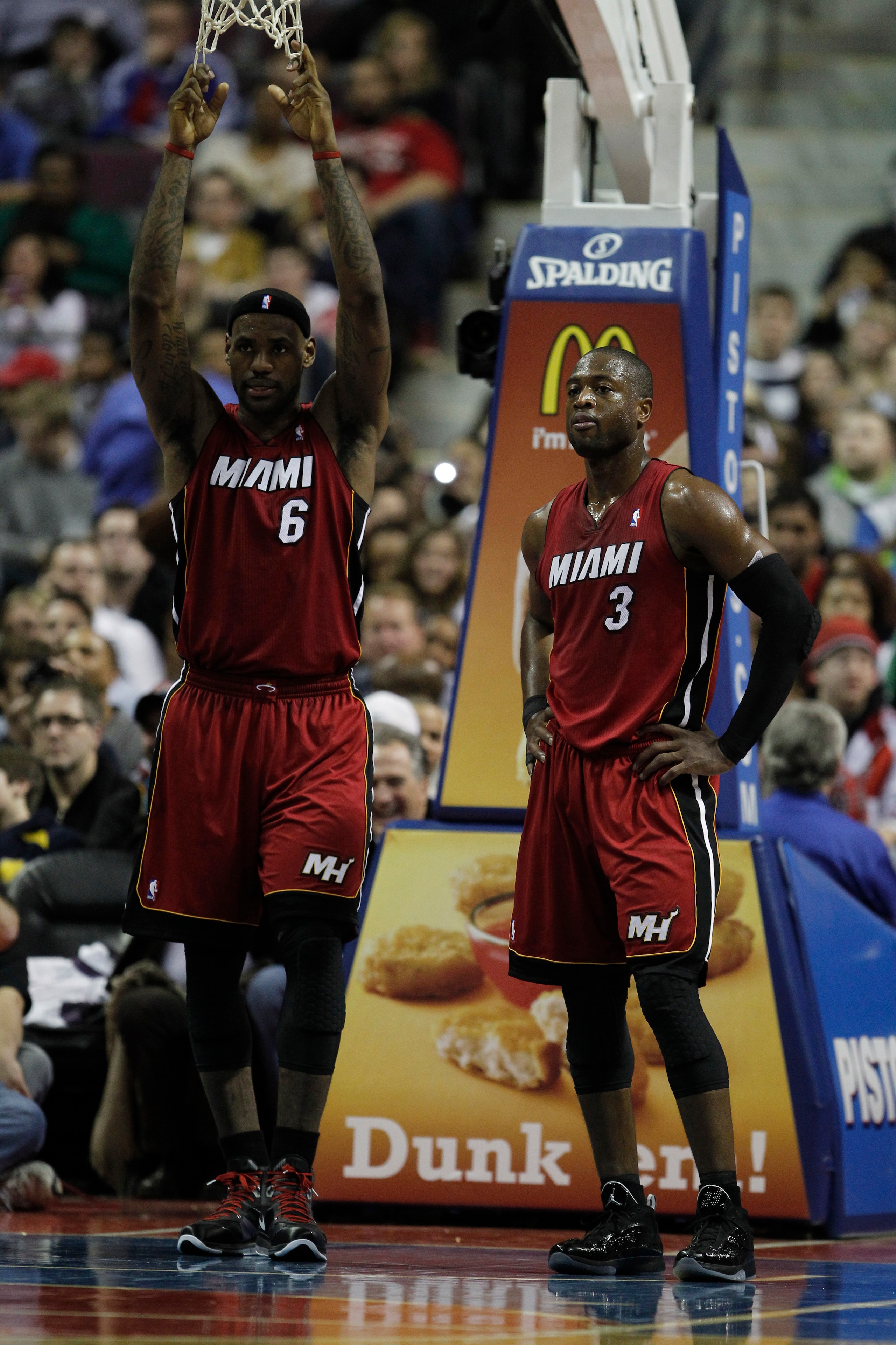 AUBURN HILLS, MI - FEBRUARY 11:  LeBron James #6 and Dwyane Wade #3 of the Miami Heat look on while playing the Detroit Pistons at The Palace of Auburn Hills on February 11, 2011 in Auburn Hills, Michigan. Miami won the game 106-92.  (Photo by Gregory Sha