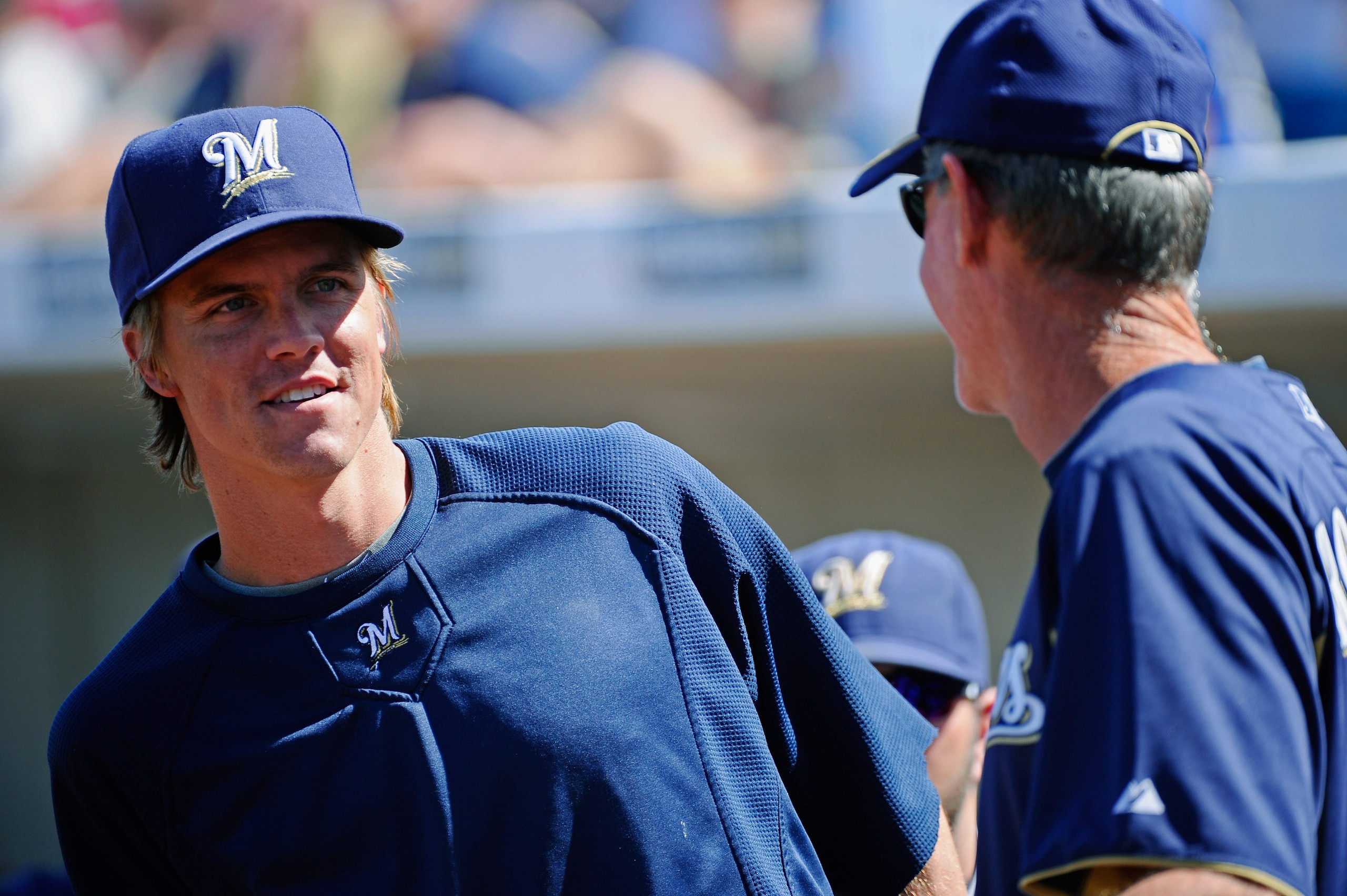 PHOENIX, AZ - MARCH 10: Pitcher Zack Greinke #13 of the Milwaukee Brewers speaks with manager Ron Roenicke during the spring training baseball game against Colorado Rockies at Maryvale Baseball Park on March 10, 2011 in Phoenix, Arizona. (Photo by Kev PHOENIX, AZ - MARCH 10: Pitcher Zack Greinke #13 of the Milwaukee Brewers speaks with manager Ron Roenicke during the spring training baseball game against Colorado Rockies at Maryvale Baseball Park on March 10, 2011 in Phoenix, Arizona. (Photo by Kev