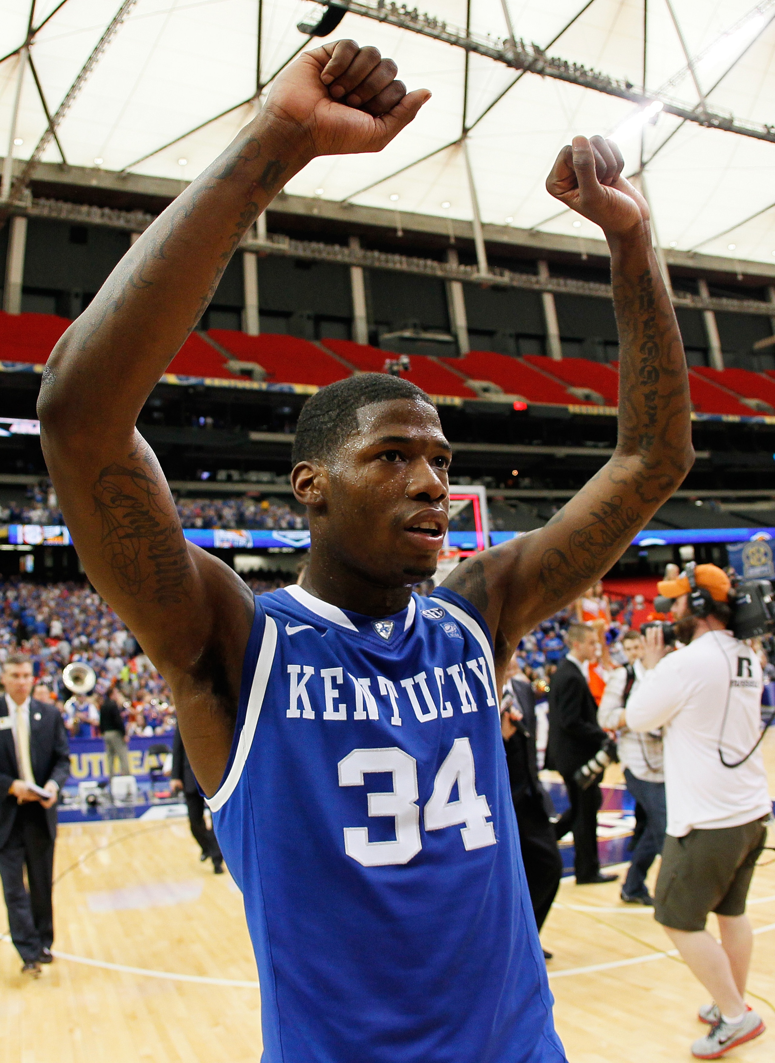 ATLANTA, GA - MARCH 13: Deandre Liggins #34 of the Kentucky Wildcats celebrates their 70 to 54 win over the Florida Gators in the championship game of the SEC Men's Basketball Tournament at Georgia Dome on March 13, 2011 in Atlanta, Georgia. (Photo by K ATLANTA, GA - MARCH 13: Deandre Liggins #34 of the Kentucky Wildcats celebrates their 70 to 54 win over the Florida Gators in the championship game of the SEC Men's Basketball Tournament at Georgia Dome on March 13, 2011 in Atlanta, Georgia. (Photo by K