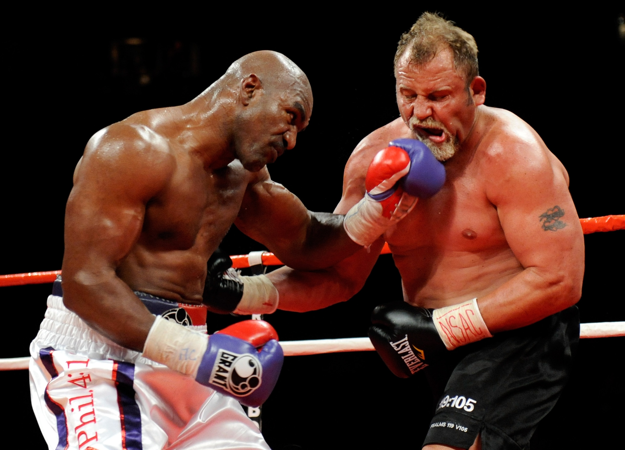 LAS VEGAS - APRIL 10:  Evander Holyfield (L) hits Francois Botha in the seventh round of their heavyweight bout at the Thomas & Mack Center April 10, 2010 in Las Vegas, Nevada. Holyfield won by TKO in the eighth round.  (Photo by Ethan Miller/Getty Images