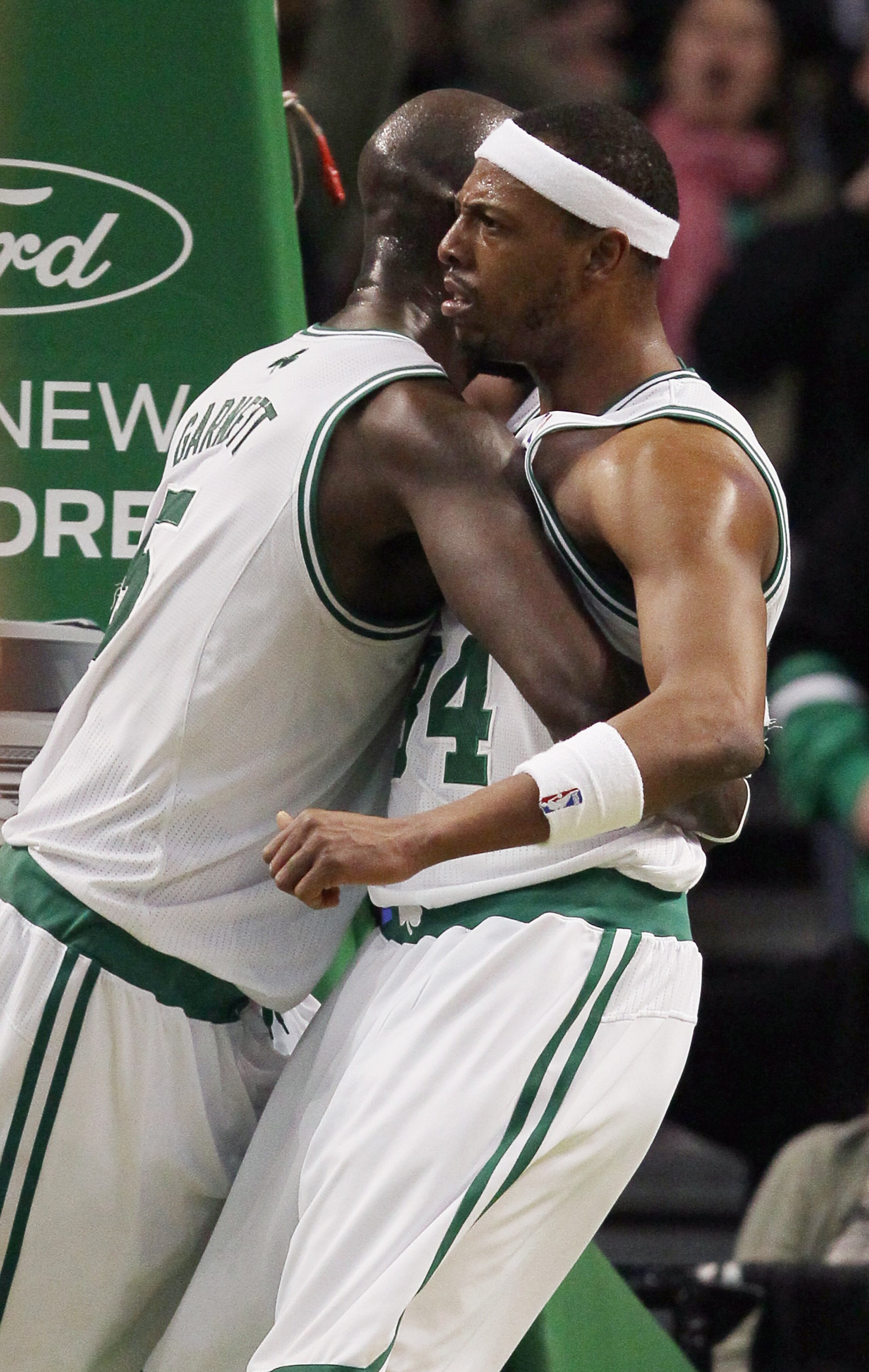 BOSTON, MA - MARCH 02:  Paul Pierce #34 is congratulated by teammate Kevin Garnett #5  of the Boston Celtics on March 2, 2011 at the TD Garden in Boston, Massachusetts.  The Celtics defeated the Phoenix Suns 115-103. NOTE TO USER: User expressly acknowled