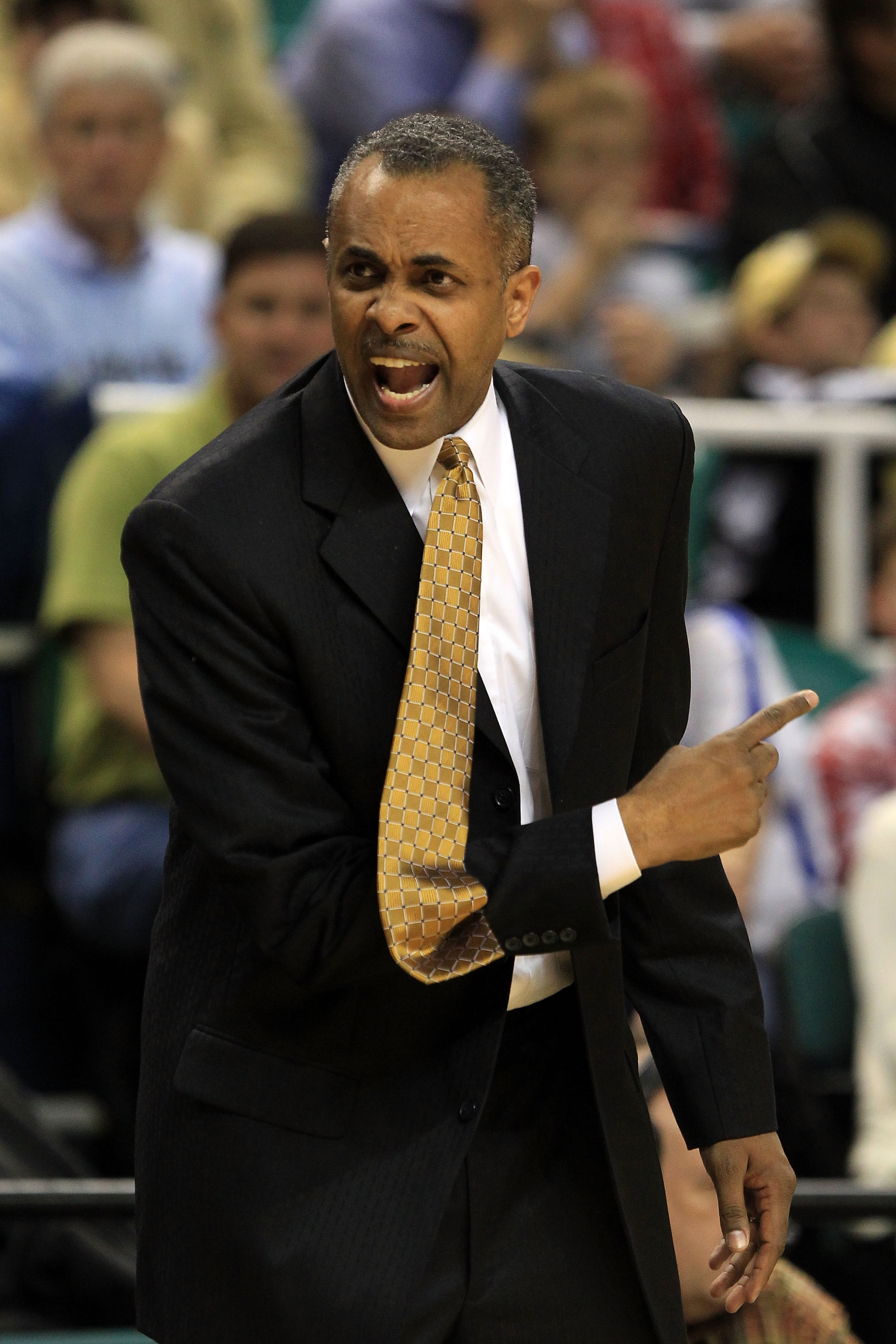 GREENSBORO, NC - MARCH 10:  Head coach Paul Hewitt of the Georgia Tech Yellow Jackets communicates with his team during the first half of the game against the Virginia Tech Hokies in the first round of the 2011 ACC men's basketball tournament at the Green