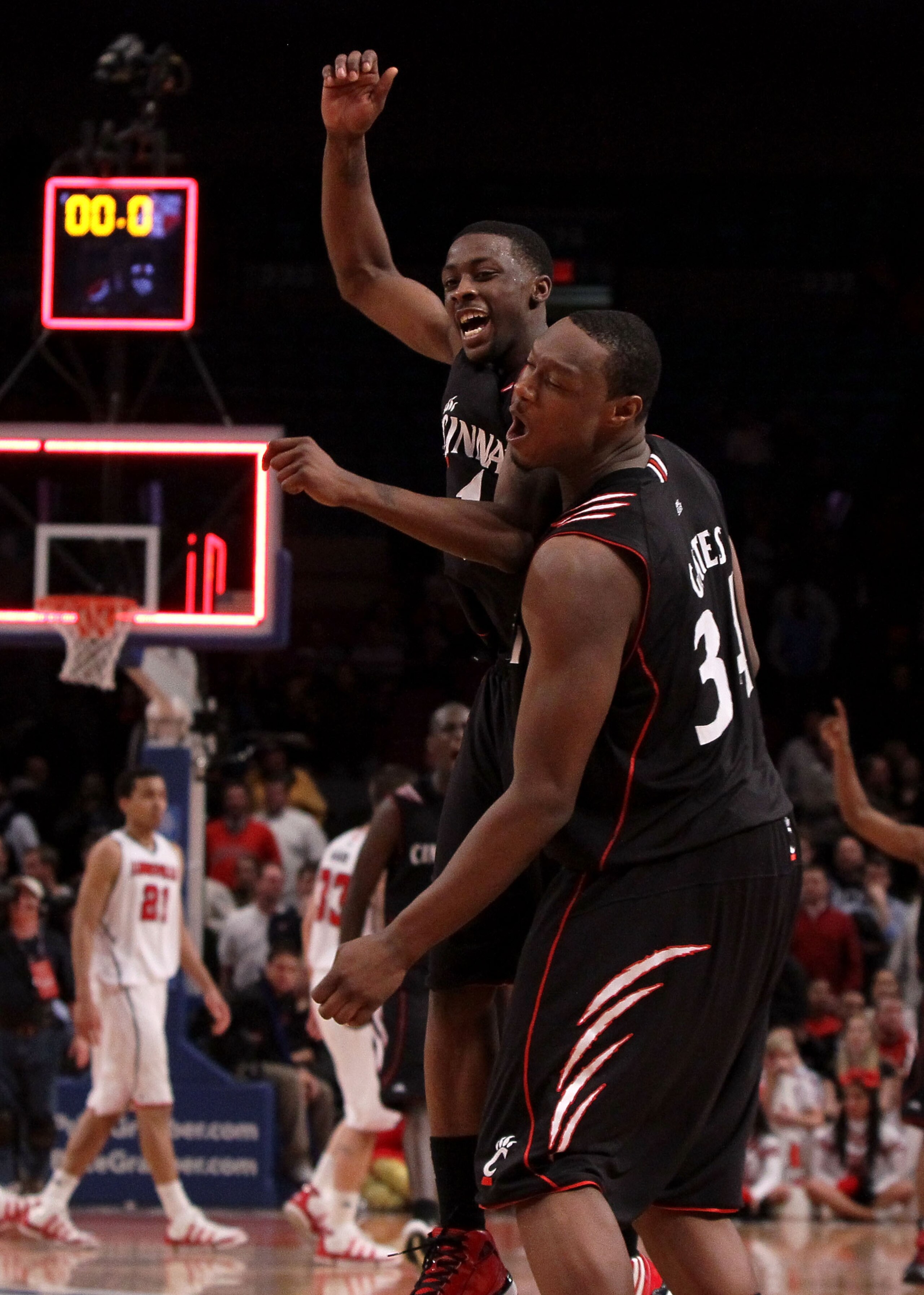 NEW YORK - MARCH 10: Cashmere Wright #1 and Yancy Gates #34 of the Cincinnati Bearcats celebrate after defeating the Louisville Cardinals during the second round of 2010 NCAA Big East Tournament at Madison Square Garden on March 10, 2010 in New York City. NEW YORK - MARCH 10: Cashmere Wright #1 and Yancy Gates #34 of the Cincinnati Bearcats celebrate after defeating the Louisville Cardinals during the second round of 2010 NCAA Big East Tournament at Madison Square Garden on March 10, 2010 in New York City.