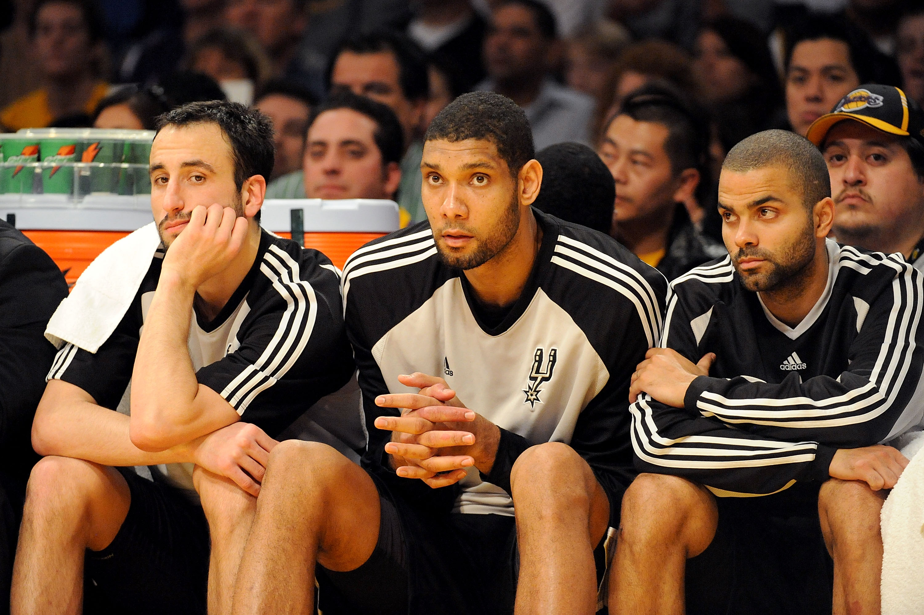 LOS ANGELES, CA - JANUARY 25:  (L-R) Manu Ginobili #20, Tim Duncan #21, and Tony Parker #9 of the San Antonio Spurs watch from the sidelines during the third quarter against the Los Angeles Lakers at the Staples Center on January 25, 2009 in Los Angeles,
