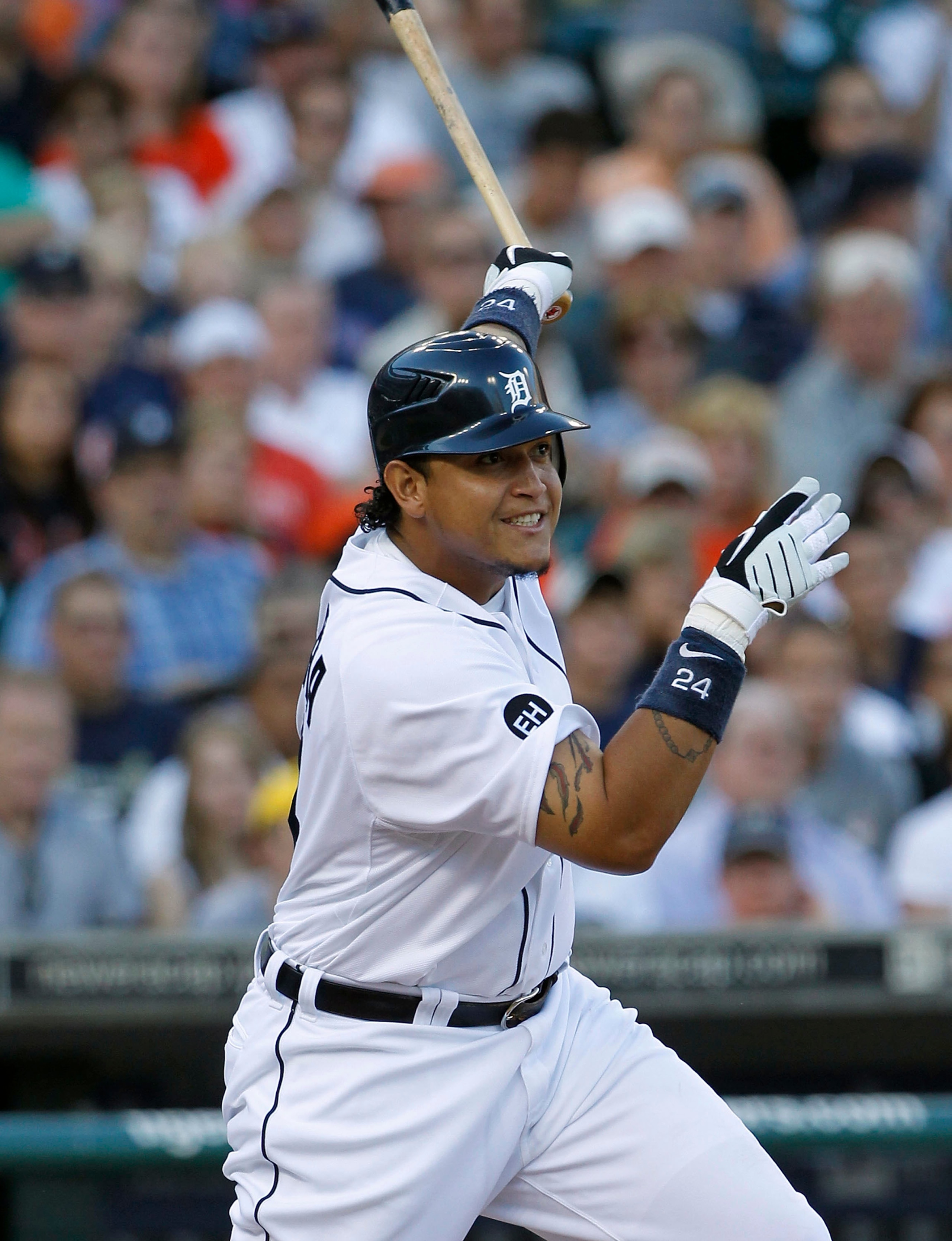 DETROIT - JULY 09:  Miguel Cabrera #24 of the Detroit Tigers hits a sacrifice fly in the second inning scoring Ryan Raburn  during the game against the Minnesota Twins on July 9, 2010 at Comerica Park in Detroit, Michigan. The Tigers defeated the Twins 7-