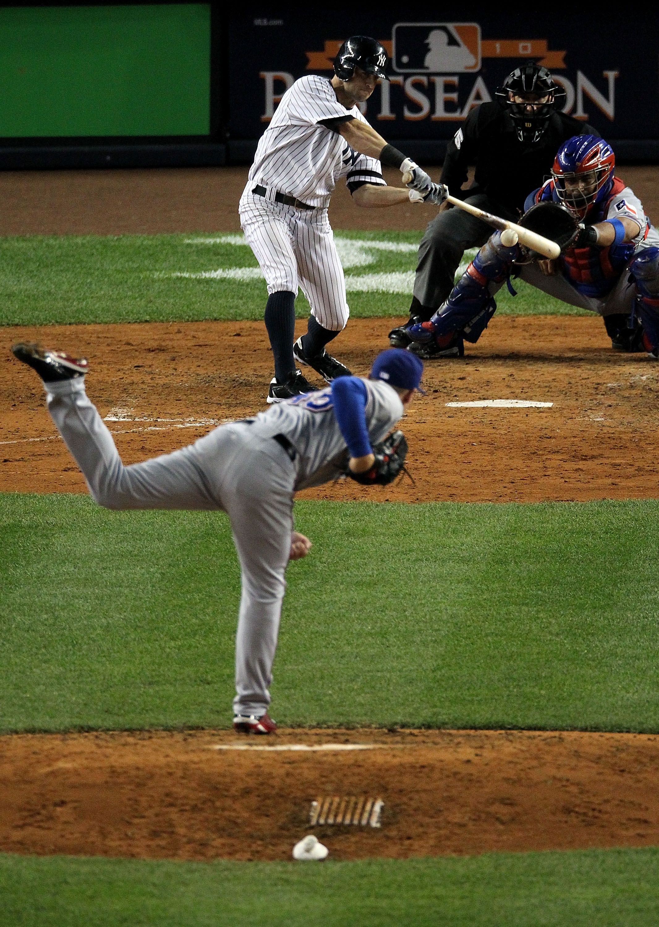 NEW YORK - OCTOBER 19:  Brett Gardner #11 of the New York Yankees hits an RBI in the fourth inning against Derek Holland #45 of the Texas Rangers in Game Four of the ALCS during the 2010 MLB Playoffs at Yankee Stadium on October 19, 2010 in the Bronx boro