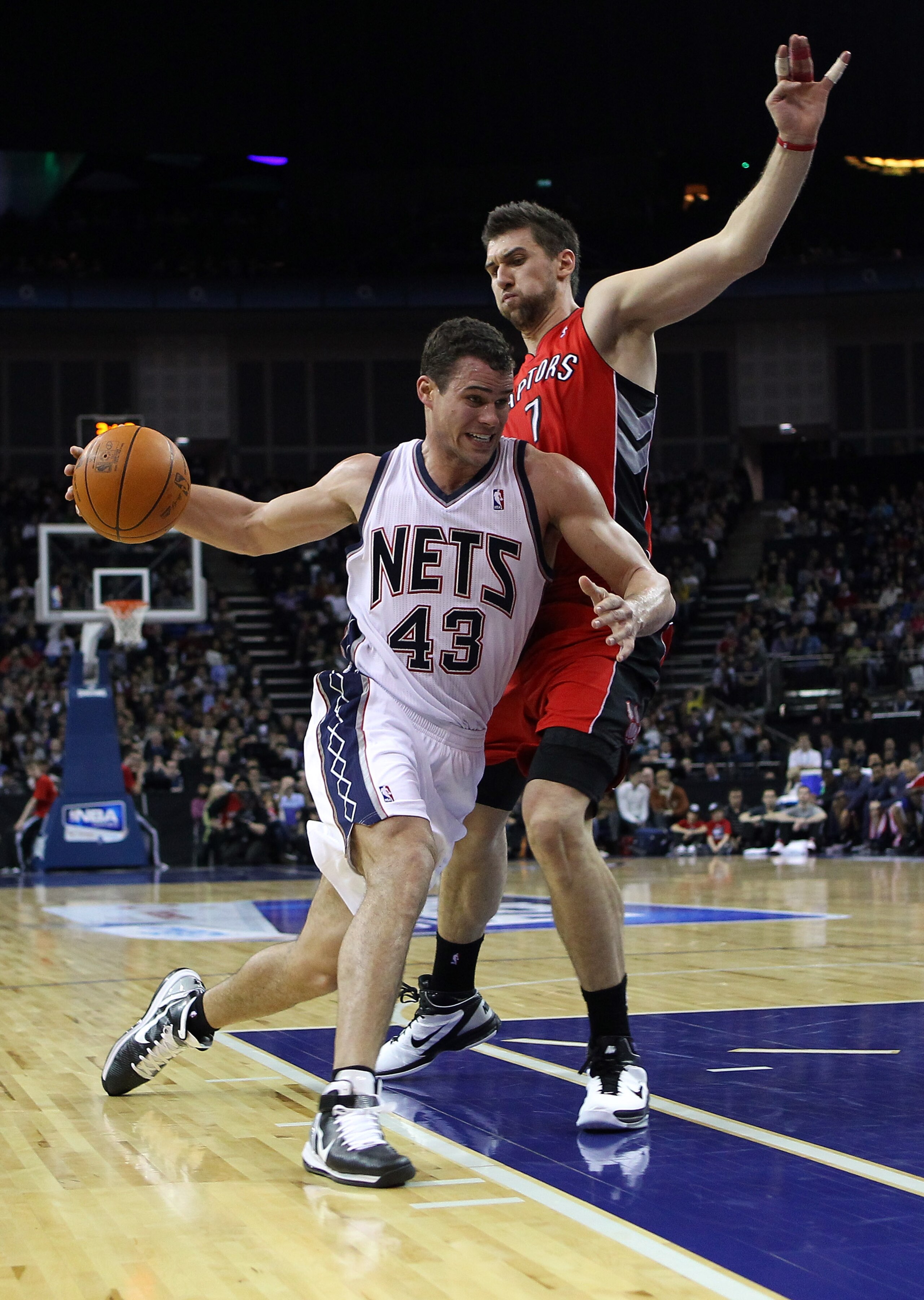 LONDON, ENGLAND - MARCH 04: Kris Humphries of the Nets goes around Andrea Bargnani of the Raptors during the NBA match between New Jersey Nets and the Toronto Raptors at the O2 Arena on March 4, 2011 in London, England. NOTE TO USER: User expressly ackno LONDON, ENGLAND - MARCH 04: Kris Humphries of the Nets goes around Andrea Bargnani of the Raptors during the NBA match between New Jersey Nets and the Toronto Raptors at the O2 Arena on March 4, 2011 in London, England. NOTE TO USER: User expressly ackno