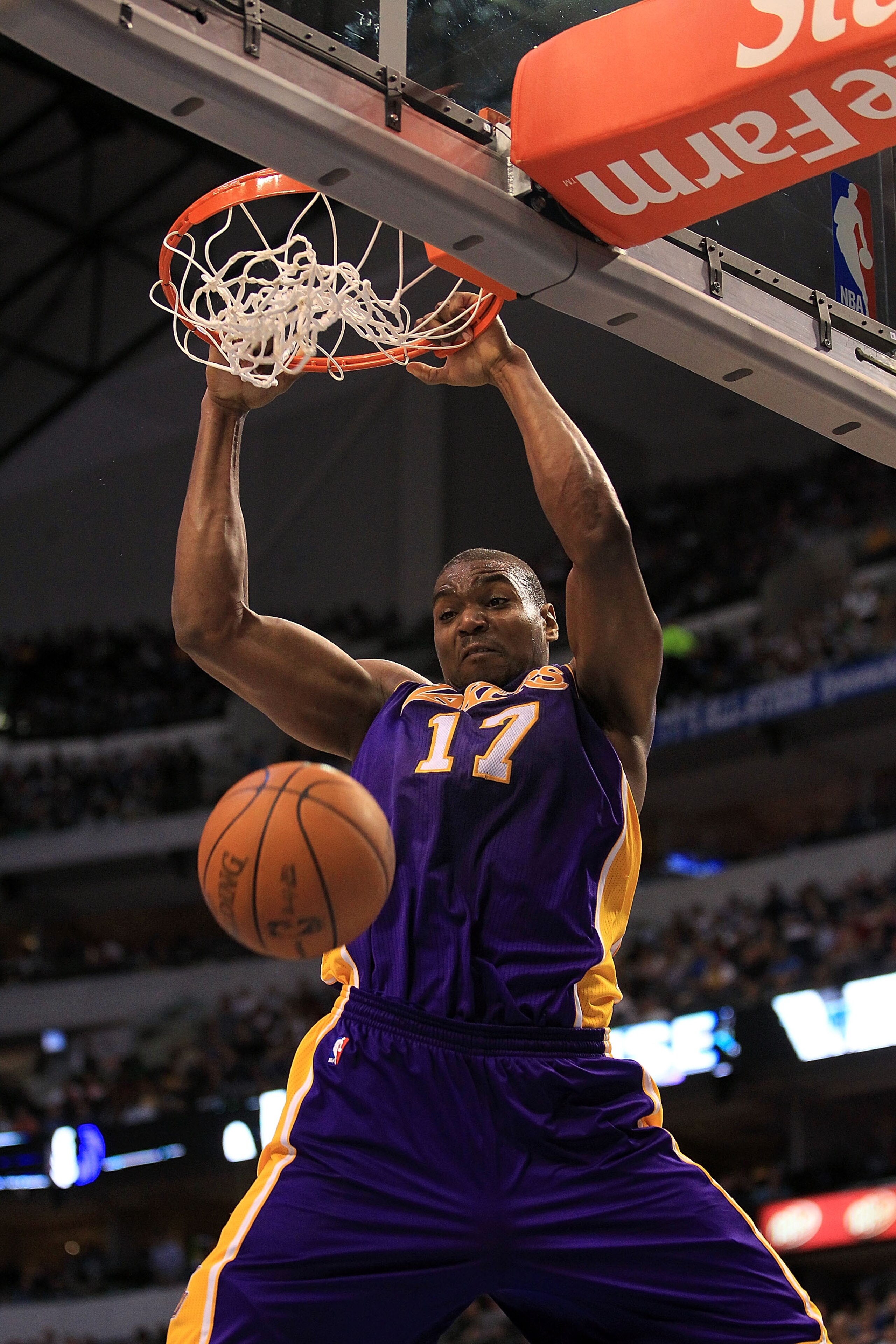 DALLAS, TX - MARCH 12: Center Andrew Bynum #17 of the Los Angeles Lakers gets the slam dunk against the Dallas Mavericks at American Airlines Center on March 12, 2011 in Dallas, Texas. NOTE TO USER: User expressly acknowledges and agrees that, by downlo DALLAS, TX - MARCH 12: Center Andrew Bynum #17 of the Los Angeles Lakers gets the slam dunk against the Dallas Mavericks at American Airlines Center on March 12, 2011 in Dallas, Texas. NOTE TO USER: User expressly acknowledges and agrees that, by downlo