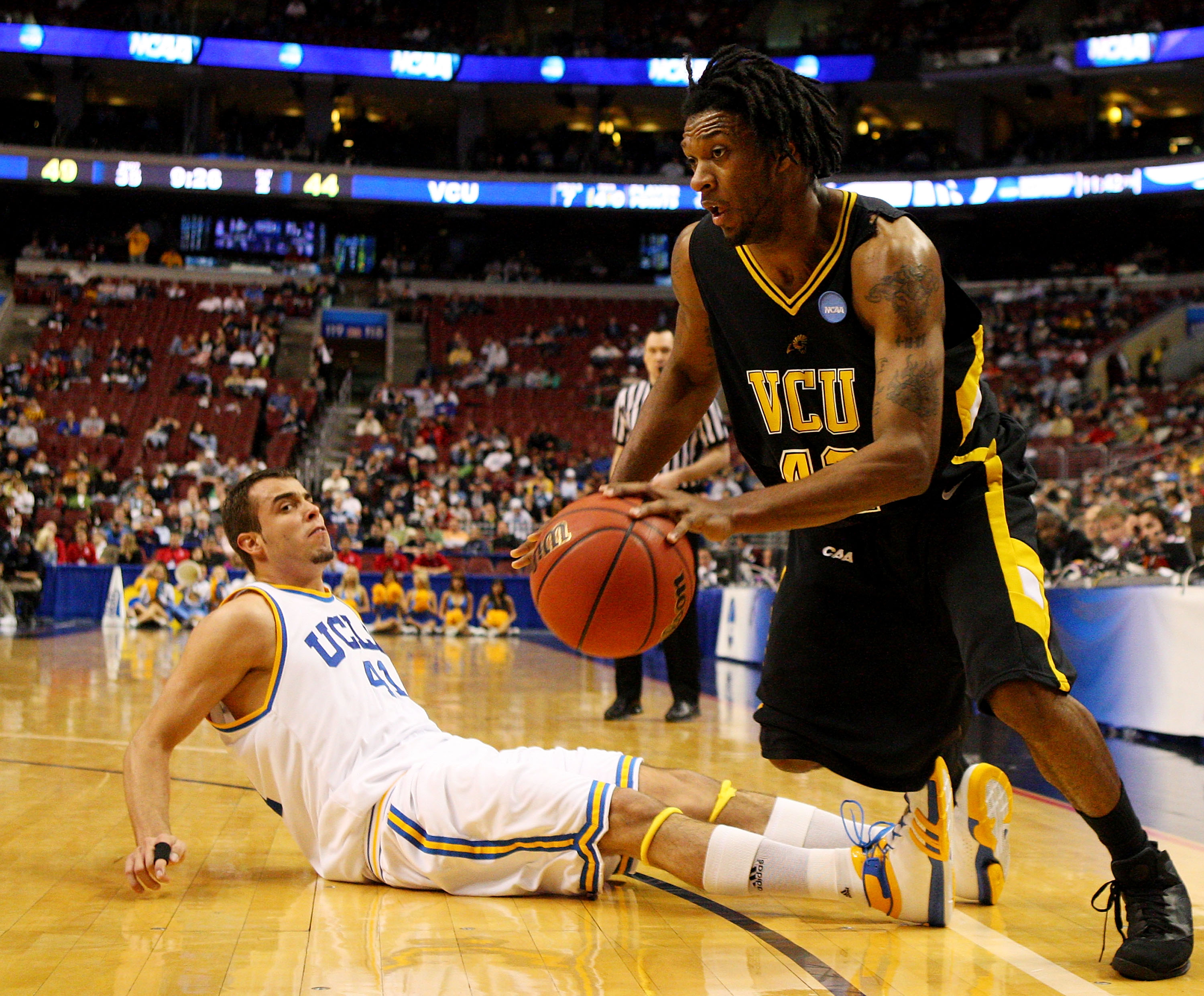 PHILADELPHIA - MARCH 19: T.J. Gwynn #42 of the VCU Rams drives past Nikola Dragovic #41 of the UCLA Bruins during the first round of the NCAA Division I Men's Basketball Tournament at the Wachovia Center on March 19, 2009 in Philadelphia, Pennsylvania.